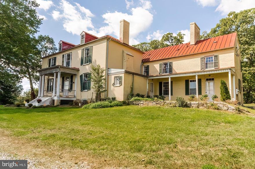 Welcome to Belvedere Mansion, circa 1807.
The 5.15 acre residue parcel encompasses the mansion property.  The elegant home has so many possibilities, including dividing it into 2 extraordinary villa homes. Live in one side and rent the other or use the property as a small venue with graceful grounds and beautiful large trees in a private treed area.  Or bring the entire home back to life with it's wonderful wood floors, handsome trim and dental moldings, fireplaces in most rooms, interesting entry doors from several areas and a circular driveway for ample parking while hosting your guests.  HOME IS BEING SOLD AS IS, WHERE IS

Belvedere, also known as Belvidere, was built near Charles Town, West Virginia by Magnus Tate II in 1807. The Federal style mansion is situated at the end of a tree-lined driveway and commands a sweeping view of the Blue Ridge Mountains. The house grew from the original "kitchen house" section to a formal three-bay brick main house built in 1824 by Magnus's son William, which were separate until they were connected in 1939.[2]

The site was inhabited by the Tate family from the 1760s. Magnus Tate II (1732-1808) was a founder of Charles Town. His four sons were all born at Belvedere. Magnus Tate III (1767-1823) served in the Virginia Assembly before serving from 1815 to 1817 in the U.S. House of Representatives. Belvedere passed to William Tate (1776-1818), and then to his son, George Tate II. The house passed out of the Tate family in 1882.[2]

Description
The two-story brick house is one room deep with a center hall the depth of the house. A three-part central window on the second floor complements the sidelights and transom at the front door below. A small entrance porch with paired columns is original to the house.[3] The end of the older section flanking the 1824 house features a rosette window at attic level and a side door with a transom and sidelights, both in the gable elevation.