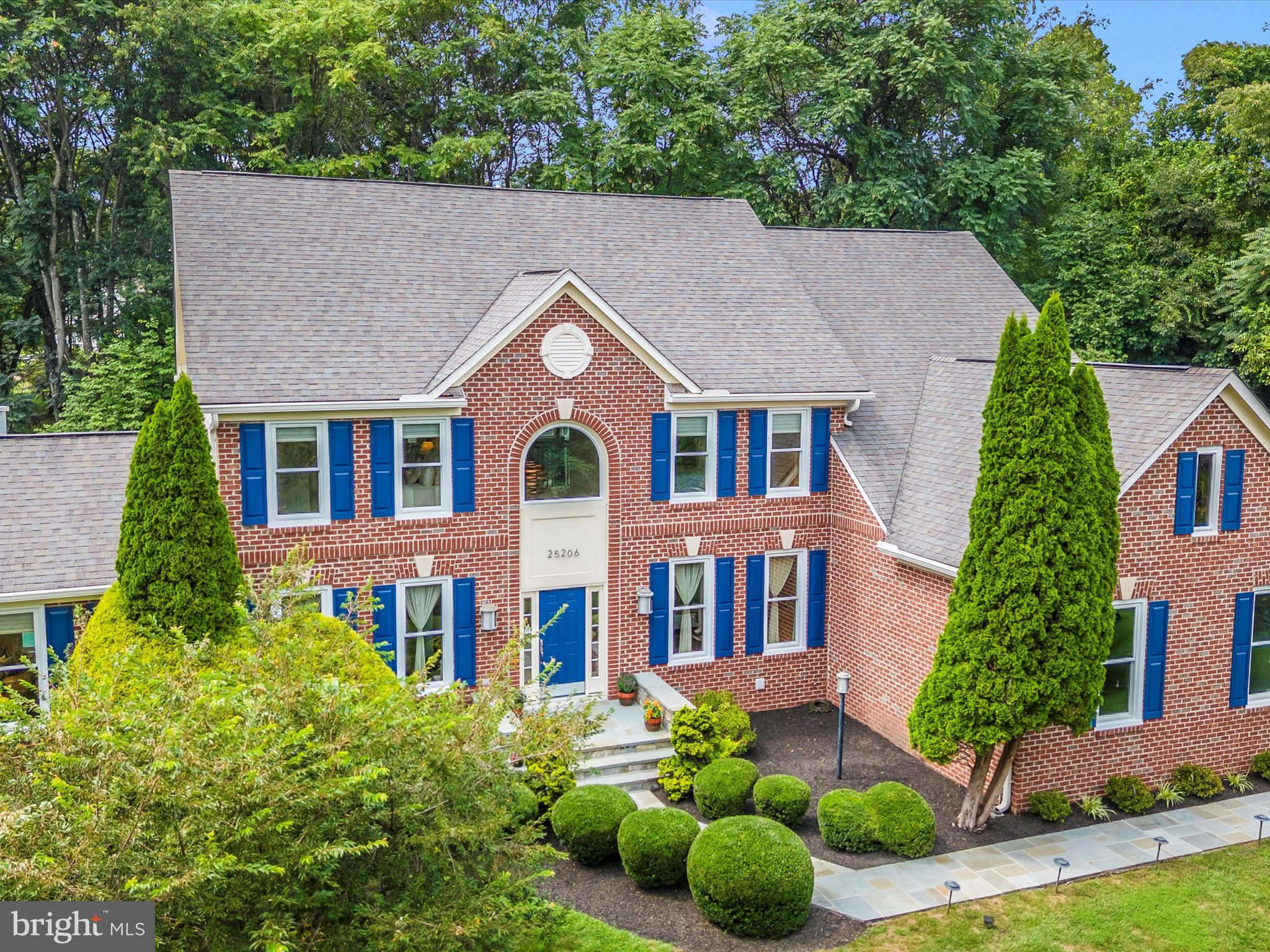 Experience the epitome of luxury living in this stunning 4-bedroom, 3.5-bath brick-front colonial boasting over 6,700 square feet of beautifully finished living space across three expansive levels. From the moment you step into the grand two-story foyer, you'll be captivated by the elegant, solid Brazilian hardwood floors and dual staircases with wrought iron balusters. The main level features a seamless blend of formal and casual living spaces, highlighted by a sun-drenched conservatory, a light-filled sunroom, and a gracious formal dining room, all enhanced by recessed lighting and intricate detailing. The gourmet kitchen features granite countertops, a ceramic backsplash, and brand-new Café Collection stainless steel appliances (2023), which flow effortlessly into a dramatic two-story family room with 20-foot ceilings and a ceiling fan.
Retreat to the fully finished lower level, which features a walk-up exit, a mini kitchen, and ample space for entertaining or extended living. This home offers comfort and efficiency with a 3-zone Carrier HVAC system (installed in 2019), a new 75-gallon water heater (installed in 2022), and all-new windows installed in 2023.
Step outside to your private oasis, where extensive hardscaping, stone walls, patio pavers, and landscape lighting surround a sparkling Pebble Tec saltwater pool and a charming 12x20 pool house—perfect for summer gatherings. The three-car side-load garage features 8-foot entry doors and provides ample space for vehicles and storage. Every detail of this exceptional home has been thoughtfully curated to provide elegance, comfort, and function. Welcome home!