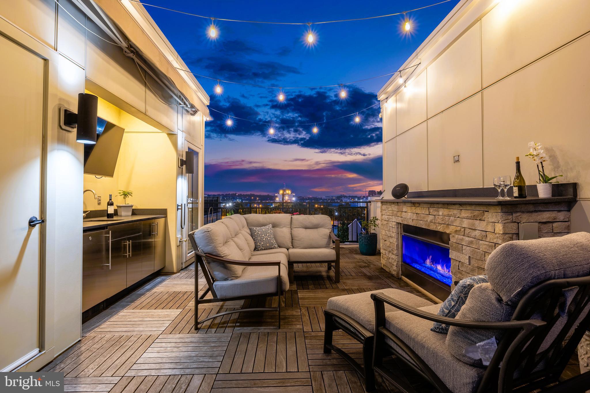 SHORT TERM LEASE AND FULLY FURNISHED OPTION AVAILABLE. PETS CONSIDERED CASE BY CASE. Super sleek ALTA47 with every bell and whistle imaginable. Originally one of the community’s model homes, this residence blends on-trend style with modern convenience. It offers a fully integrated smart home system, direct water views from most floors, a fully built-out rooftop deck with gas fireplace, outdoor TV, and stone stacked grill, a two-car garage with honed concrete floors plus pops of stunning wallpaper, hardwood flooring, and designer lighting fixtures throughout make the the entire space feel not only elevated but also practical.
On the main level, a stylish home office welcomes you with beautiful reed grass wallpaper and custom built-ins. And while parking in Locust Point is rarely a challenge, this home offers the ease of an attached two-car garage and a communal parking lot behind the property, doubling as a gathering spot where kids can play and neighbors can mingle.
The second floor delivers unexpected tranquility, with floor-to-ceiling windows framing leafy, swaying trees, making it feel more like a suburban sanctuary than a city street. An airy, open-concept floorplan centers around the kitchen, where an extra-long quartz island seats five or more and flows seamlessly into the spacious living and dining areas. A double pantry adds rare storage, while a stacked-stone accent wall lends texture and warmth to the living room. A convenient and stylish powder room completes this floor.
Upstairs, three bedrooms and two full baths balance modern style with everyday comfort. The primary suite offers a generous layout with a walk-in closet, and a spa-like en-suite featuring double vanity and glass-enclosed shower. Floor-to-ceiling windows fill the space with light and frame calming water views. Down the hall, you’ll find a second full bath with tub/shower combo, a laundry room with upgraded washer/dryer, and two additional bedrooms with playful wallpaper, contemporary lighting, and large windows overlooking treetops.
The top floor offers a show-stopping, full length rooftop deck with every possible upgrade. Soak in unobstructed water views while cozied up next to the gas fireplace, serve drinks from the stone-topped wet bar with wine fridge and sink, watch the big game on the outdoor tv while cooking a feast on the outdoor grill, or relax in the shade of the full length motorized awning while the bistro lights twinkle above. From air shows and firework displays to intimate dinners under the stars, this is Baltimore city living at its absolute best.
Beyond the home, you’ll find yourself loving life in one of Baltimore’s most sought-after neighborhoods. This small peninsula has a close-knit, small-town vibe, yet sits in the heart of the city. Stroll from one side of the peninsula to the other in 11 minutes, passing everything you could need on your way: coffee shops, restaurants, grocery stores, salons...You name it, it's here. There's also plenty of greenspace to enjoy, from Latrobe Park—with playground, dog park, sports fields, and basketball/tennis courts, to historic Fort McHenry’s waterfront trails. Commuting is a breeze, thanks to the free water taxi to Fells Point, Harbor East, and Canton and the Charm City Circulator which will take you into downtown. There's also quick access to I-95 and major employers like Johns Hopkins, UMD, and Under Armour are also close by.
Interested in learning more? Contact me to schedule a tour!