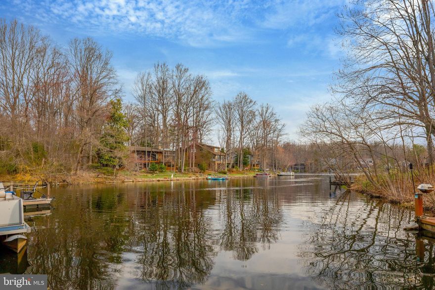 *TRUE WATERFRONT HOME ON PREMIER LAKE THOREAU* PRIVATE DOCK* PROPERTY LINE EXTENDS TO THE WATER+* 37 FEET OF SHORE LINE (MOST IN COMMUNITY) *Resort Living  with the Convenience of Wiehle Silver Line Metro & Dulles Toll Rd Less Than 1 Mile  & Dulles Airport a 15 Minute   Drive Away.  Walk to Schools (ES,MS & HS)  Located at Turtle Pond & Ridge Heights!  Less than a Mile Walk  on Reston Walking Path to South Lakes Shopping Center*Lake Thoreau Pool Next to the Community*2-Car Attached Garage with Wall of Cabinets for Storage.  Lake Views on 3 Levels.  Beautifullly Remodeled at End of 2024.  Architectually Interesting Design with Delightful Open & Airy Floor Plan.  Large Skylights and an  Abundance of Ceiling-to-Floor Windows/Doors for Maximum Light that brings the Beautiful Views of Outdoors and the Lake Inside.  Large Decks on Main and Lower Levels Connected by Circular Stairs*Designer Chef's Kitchen with High End Stainless Steel Appliances (KitchenAid/GE Profile and Vented Hood-Best By Brian), 5-Burner Glass Cooktop with Bridge, Double Ovens (1 Convection), Natural  Maple  Cabinets (Some with Glass Doors), Granite Counters,  Under Cabinet Lighting, Pendants and Recessed  Lighting.  Beautiful Hardwood Floors. Formal Dining Room, Separate Breakfast Area & Spacious Living  Room with New Motorized, Insulating Blinds with Remote Control and Access to Large Main Level Deck.  *Upper Level Large Primary Bedroom Suite w/Lake Views/Private Balcony/Fireplace/Built-Ins, 2 Closets (1 Walk-In with Organizers) & Luxurious Bath with Deluxe Spa Tub (Air Jets, Whirlpool, Lights, Waves and More) + Heated Floors, Double Vanity, Large Custom Walk-In-Shower with Seat, 2 Separate Shower Heads & Wall Jets * Upper Level has Additional 2nd and 3rd Bedrooms(1 w/Balcony), Bonus Alcove Area, Updated Bath. Laundry Room with Samsung Front-Load Washer & Dryer, Laundry Sink & Cabinets.  Lower level Has  Custom Bath  with Large Tiled Shower/Vessel Sink Vanity, Large Recreation Room with fireplace, Wetbar, New Carpet and 4th Bedroom/Sitting Room Suite(Currently Used as an Office) with Floor-to-Ceilings Windows & Doors  Overlooking the Deck and Lake.  2-Zoned HVAC. Low Cluster Dues. Pontoon Boat with Batteries, Charger & Motor Convey As-Is.  DON'T MISS THIS OPPORTUNITY TO LIVE IN A SPECTACULAR RESTON HOME ON LAKE THOREAU!