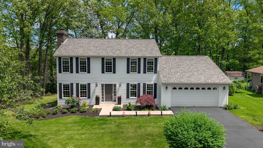 Spacious, stylish, and beautifully maintained in Park Forest Village! Neutral tones, hardwood floors, and refined modern finishes establish a cohesive and inviting feel in every space. The kitchen features leather-finish granite countertops, stainless steel appliances, and a breakfast bar, opening seamlessly to the dining room and extending to an expansive composite deck. The main level offers three distinct living areas, anchored by a generous living room with a stone fireplace and direct access to the deck. Two additional rooms provide flexible options for a family room, home office, or playroom. A half bath completes this level. The upper level features a spacious primary suite with a walk-in closet and private full bath, along with three additional bedrooms and a second full bath. The lower level adds flexibility with a fifth bedroom, full bath, and a large living space with a fireplace—ideal for a gym, hobby room, or casual hangout area. Tucked at the end of a cul-de-sac, this home is just minutes from shopping, dining, schools, parks, and everyday amenities.