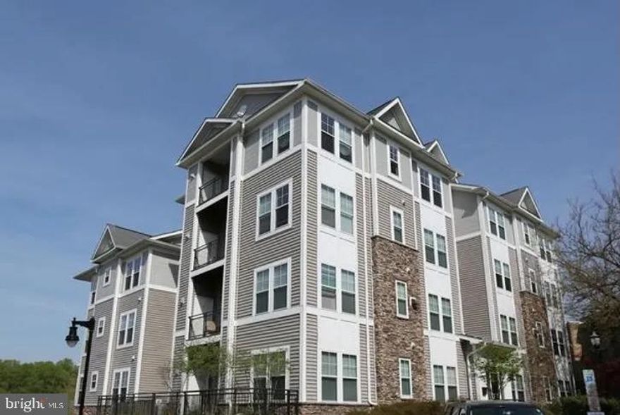 Large three bedroom, two full bath condo located in gated community in Capitol Heights. Huge owner's suite with en-suite bathroom, open floor plan, balcony, lots of storage, in unit washer and dryer, cozy living room with fireplace. Community clubhouse includes a fitness center (free to use anytime - no other gym membership is needed) and a great room that can be rented for all your hosting needs. Short drive into DC and VA (approximately 15 minutes without traffic). Located minutes from FedExField, Steeple Chase Crossing, and the new retail stores at Exit 13, including Costco, Bed Bath & Beyond, and Dave & Busters.