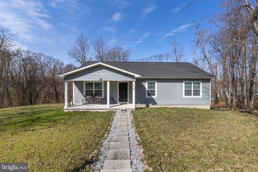 Looking for a home that feels nearly new without the wait for new construction? This beautifully maintained ranch-style home offers the perfect blend of comfort, modern updates, and functional living space.

The main level features an inviting open-concept layout connecting the kitchen, dining, and living areas—ideal for everyday living and entertaining. The gourmet kitchen has been upgraded with all new WiFi-enabled smart appliances, including a sleek induction range, along with stainless steel finishes, white cabinetry, and granite countertops that create a clean, modern aesthetic.

This home offers three spacious bedrooms and two full bathrooms, including a well-appointed primary suite with a dual vanity, tiled shower, and relaxing soaking tub.

Additional highlights include a partially finished basement with interior access from the oversized two-car garage, providing excellent space for storage, hobbies, or future finishing potential. A convenient mudroom area offers practical entry from the garage.

Situated on a beautiful 0.79-acre lot, the property provides privacy, mature trees, and room to enjoy the outdoors. The large front porch is the perfect spot to relax and enjoy quiet evenings.

Located in the Shenandoah North community, residents enjoy access to community amenities including a pond and picnic pavilion, while still being close to commuter routes to Northern Virginia, Charles Town, and surrounding areas.

This move-in-ready home combines modern upgrades, a desirable layout, and a peaceful setting—schedule your showing before it's gone.