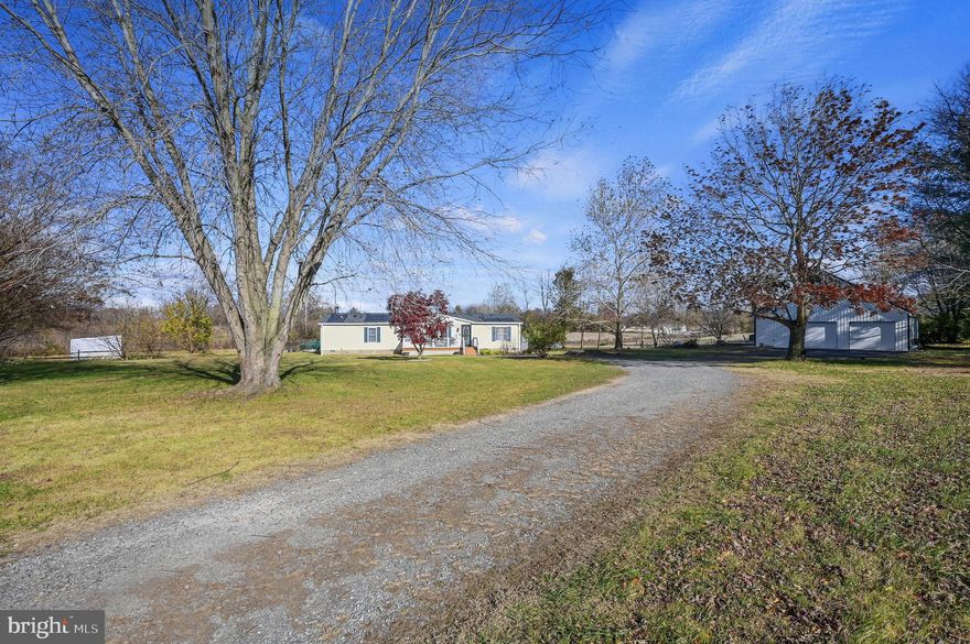 Have you been wanting your very own HOMESTEAD???!!! 

This inviting property offers 2.2 acres of peaceful, gently sloping land—perfect for the cutest Highland cattle, pony, donkey, llamas, chickens, pets, & much more! Tucked away at the end of a private, shared-maintenance road, this home enjoys rare seclusion and a serene setting. Mature trees and a quiet back meadow create a truly tranquil sanctuary, with plenty of space for gardens, wildflowers, and outdoor living.

The 1,660 sq. ft. home features a completely renovated open kitchen, dining, and family room layout centered around a cozy wood-burning fireplace.  The kitchen has new granite counter tops, cabinets, and appliances. A separate dining room provides additional flexibility. There are 3 bedrooms, split-bedroom floor plan offers privacy & 2 full bathrooms (newly renovated)! New flooring through out the home! Water heater and furnace are brand new.

Off the back of the home there is a large deck that overlooks the property—ideal for relaxing and enjoying nature. An above-ground pool (updated in 2024) adds to the outdoor enjoyment. Did you see the large chicken coop? This will allow you to get your homestead operating right away!!! 

In 2024 a new roof was installed, solar roofing shingles (not panels) from GAF roofing/energy. Maximum available installed on roofing. Owned not leased. Ching-Ching!!Savings on electric!!! Woohoo!! 

There is more... Did you see the MASSIVE  pole barn/2 car garage? The 38x48 pole barn, with an additional 10x10 poured concrete slab to entertain or enjoying the sunset!  The pole barn is 2 stories with electric ready to use space! You can add an additional room upstairs, use as garage, storage, or to just tinker! 
With natural beauty, privacy, and plenty of potential, this is the perfect place to bring your ideas and make it your own. Opportunities like this don’t come along often!