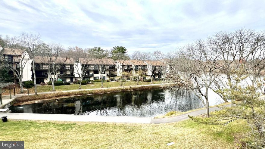 Welcome home to this beautifully refreshed top-level, 2-bedroom/2-bathroom condo overlooking Wilde Lake in Columbia, MD, offering ample natural light and a design that is both warm and inviting. This unit provides a modern feel with sought-after features like new flooring throughout, a refreshed kitchen counter/bar, and a newly-installed all-in-one washer/dryer unit - perfect for quick move-in. The open concept living room/dining room combination is ideal for gathering and entertaining, leading directly out to a two-door private balcony that offers stunning, peaceful views overlooking Wilde Lake. Offering style, function, and convenience, this condo is located in the highly desirable Cove/Village at Wilde Lake community, close to the Columbia Mall, Merriweather Post Pavilion, outdoor recreation, and major commuter routes. Schedule your showing today!