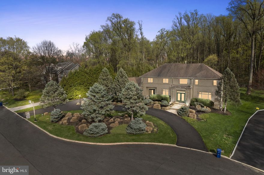 Welcome to 537 Pondview Drive, an elegant estate nestled in a secluded cul-de-sac in the prestigious Rydal neighborhood. Situated on a quiet street with only 11 homes, this residence offers the perfect blend of luxury, comfort, and privacy. This 6,690-square-foot home, including a beautifully finished basement, overlooks the tranquil Alverthorpe Park and is surrounded by lush, mature trees on a meticulously landscaped .56-acre lot. It features 4 spacious bedrooms, 4 full bathrooms, and 2 additional half baths. From the moment you step inside, you’re greeted by a bright, inviting layout featuring solid maple hardwood floors throughout the first floor, lending warmth and elegance to every space. A formal dining room sits to the left, while a versatile sitting room or playroom is to the right. The expansive great room is a true showstopper, featuring grand windows with shutters that open to let in plenty of natural sunlight, custom-built-ins, a marble fireplace, and beautiful views of the park. At the heart of the home is a gourmet eat-in kitchen with solid maple cabinetry throughout.  A large island and high-end stainless steel Café refrigerator/freezer make this space ideal for gathering and entertaining. Additionally, just off the kitchen, you'll find a walk-in pantry, ensuring plenty of space for storage, two large coat closets when you walk in from the 3-car garage, and one of the home’s conveniently located half baths.. The main level also features a private office with built-ins and direct access to the backyard, along with a second half bath nearby. Upstairs, the primary suite serves as a true oasis, filled with natural light and complete with a large walk-in closet that doubles as a dressing room, offering ample space for wardrobe organization. The primary bathroom is spacious and luxurious, creating the perfect retreat. The second floor also includes three additional bedrooms—two of which share a Jack and Jill bathroom and offer generous closet space, while the third enjoys a beautiful view overlooking Alverthorpe Park and features its own private ensuite bathroom. A hallway linen closet provides ample space for extra linens, and the conveniently located second-floor laundry room adds everyday practicality. For additional storage, there is a pull-down attic providing easy access. Downstairs, the finished basement adds an impressive 2,386 square feet of additional living space. This level includes a full bedroom and full bathroom, ideal for guests, along with a large mirrored gym and an incredibly open layout perfect for recreation, a media room, or entertaining. Several closets throughout, including a cedar closet, offer abundant storage, and there's direct access to the garage from the basement, further adding to the home’s functional design. Step outside to your private outdoor retreat. The flat backyard is perfect for play, relaxation, or entertaining, and the spacious patio is fully equipped with a built-in BBQ, additional burners, and plenty of space to dine and lounge. Whether you're hosting a summer cookout or enjoying a peaceful evening under the stars, the outdoor setup is ready to impress. Indoor and outdoor speakers extend the ambiance throughout the home and yard, perfect for entertaining or unwinding with your favorite playlist. The 3-car garage is another highlight, featuring an additional refrigerator/freezer to complement the gourmet kitchen. Additional features throughout the home include a central vacuum system for effortless cleaning, a water softener, and an electric fence for your pets. The home also boasts a brand new hot water heater and generous storage options throughout. The beautiful mature trees, quiet cul-de-sac, and exclusive street with only 11 homes create a true oasis in one of Rydal’s most sought-after settings. Experience the perfect fusion of luxury, privacy, and modern convenience in this exquisite home. Seize the opportunity to make 537 Pondview Drive your own.