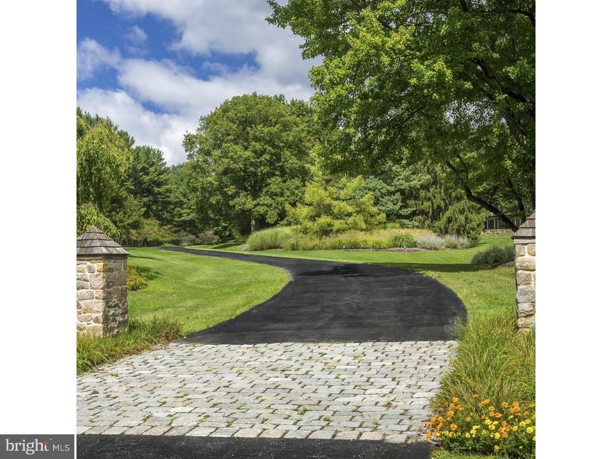 Historically, there were estate properties defined by their grandeur & grace, with long driveways leading through expansive lawns & rooms of impressive proportions that flowed effortlessly, with wonderful attention to detail including custom woodworking & hardware & boasting all the accoutrements that made for ease of living.  They are rare now, but this gracious home is an example of the best. Lovingly built with an artistic eye & a reverence for classic design elements, this breathtaking home takes its character from traditional estate homes that have been added on to as time had demanded. Tucked away on over 13 acres, the property overlooks the Saucon Valley Country Club.  One's entrance is along a curved drive, past a stone spring house & pond, leading to the classic colonial of stone & wood? reminiscent of entry to an English Manor home or to a traditional Bucks County gentleman's estate.  Inside, these charms are compounded, as each turn reveals delightful architectural details.  Fine materials & craftsmanship bespeak quality without compromise, while every element in design & execution is characterized by an understated elegance only to be expected in a home of this quality. Throughout, the rooms are bathed in light through oversized windows, exterior transoms, skylights & an array of  verandahs accessing the private acreage & overlooking fields & fauna.  Adding to the charm are the pathways to pool, pool house & various, well-executed garden areas, inviting one to sit & enjoy the environs. Befitting the needs of today's family without sacrificing luxury, there are rooms for every need or hobby, designed for large or small family gatherings. The main house has 3 fireplaces, 4 bedrooms, a paneled den, a gourmet kitchen, a sunroom with bar, a family room & two 1st floor office suites.  Set amongst a screen of mature & specimen trees, rolling lawn & long-distance vistas, outside areas for intimate or formal gatherings abound.  A separate pool & pool house, with fieldstone walls flawlessly matching the main residence, are the perfect accoutrement. A large great room is anchored by a floor- to-ceiling stone fireplace & boasts an antique bar. A separate lofted area, 2 baths, bedroom, kitchen & additional garaging complete this fabulous space. For the outdoor enthusiast, the pool & hot tub are surrounded by bluestone patios & covered verandahs. This utterly romantic home effortlessly strikes a remarkable balance between spaciousness & warm intimacy.