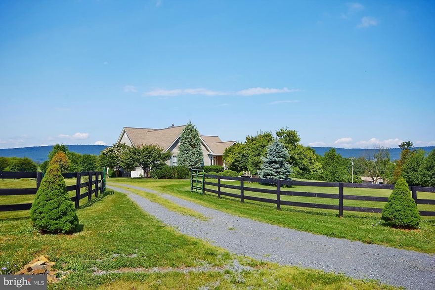 Simply gorgeous, one of a kind custom built home on 3+ acres with stunning mountain views.  Home is in move in condition.  Light, bright sun-filled open spaces.  Main level MBR separate from two guest bedrooms, wood floors, fully finished LL with bedroom, sitting area, full bath and enormous rec room.  Front porch, multiple decks/patios.  A great home for family living or formal entertaining! 10+!