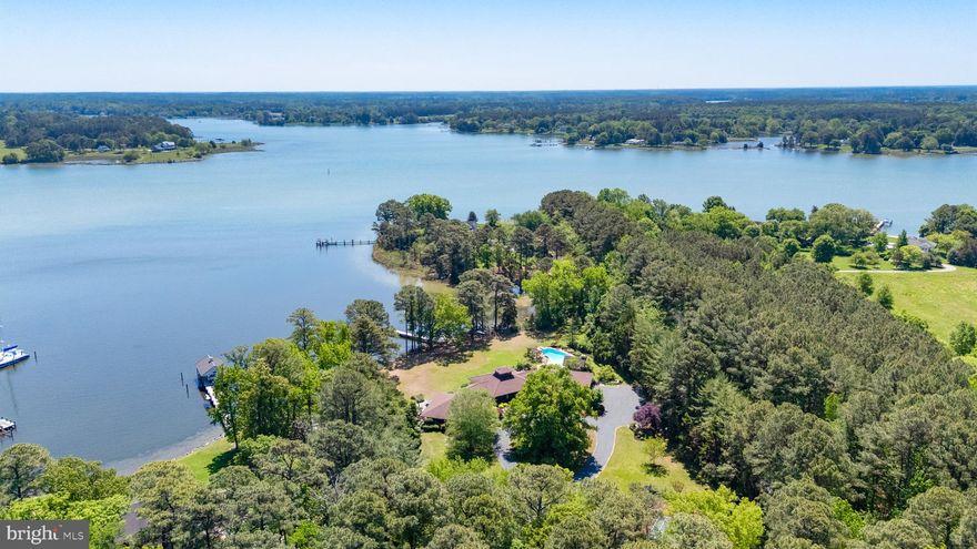 "Cypress Lodge" - Tucked away on a private waterfront lot along the Tred Avon River, this striking contemporary-style residence offers expansive water views, exceptional privacy, and thoughtfully designed indoor-outdoor living. The 3-bedroom, 5-bath home features an open floorplan filled with natural light, highlighted by soaring vaulted cathedral ceilings and clean architectural lines that create a bright, airy feel throughout. Designed to embrace its waterfront setting, the home seamlessly connects spacious living areas with multiple outdoor entertaining spaces overlooking the river. The well-thought-out outdoor living space was designed to fully maximize the property’s incredible waterfront setting, complete with a pool, outdoor fireplace, and covered pavilion overlooking both the pool and the water. Whether hosting guests or enjoying a quiet evening at home, the outdoor spaces offer a seamless extension of the home’s contemporary design and relaxed Eastern Shore lifestyle. Additional exterior amenities include a private dock, private tennis court, and hot tub, all surrounded by mature landscaping and a peaceful setting that enhances the property’s sense of seclusion. Ideally located just outside of Easton, the property provides convenient access to Washington, D.C., Baltimore, and Philadelphia, making it an exceptional full-time residence or weekend getaway within reach of several major metropolitan areas.
