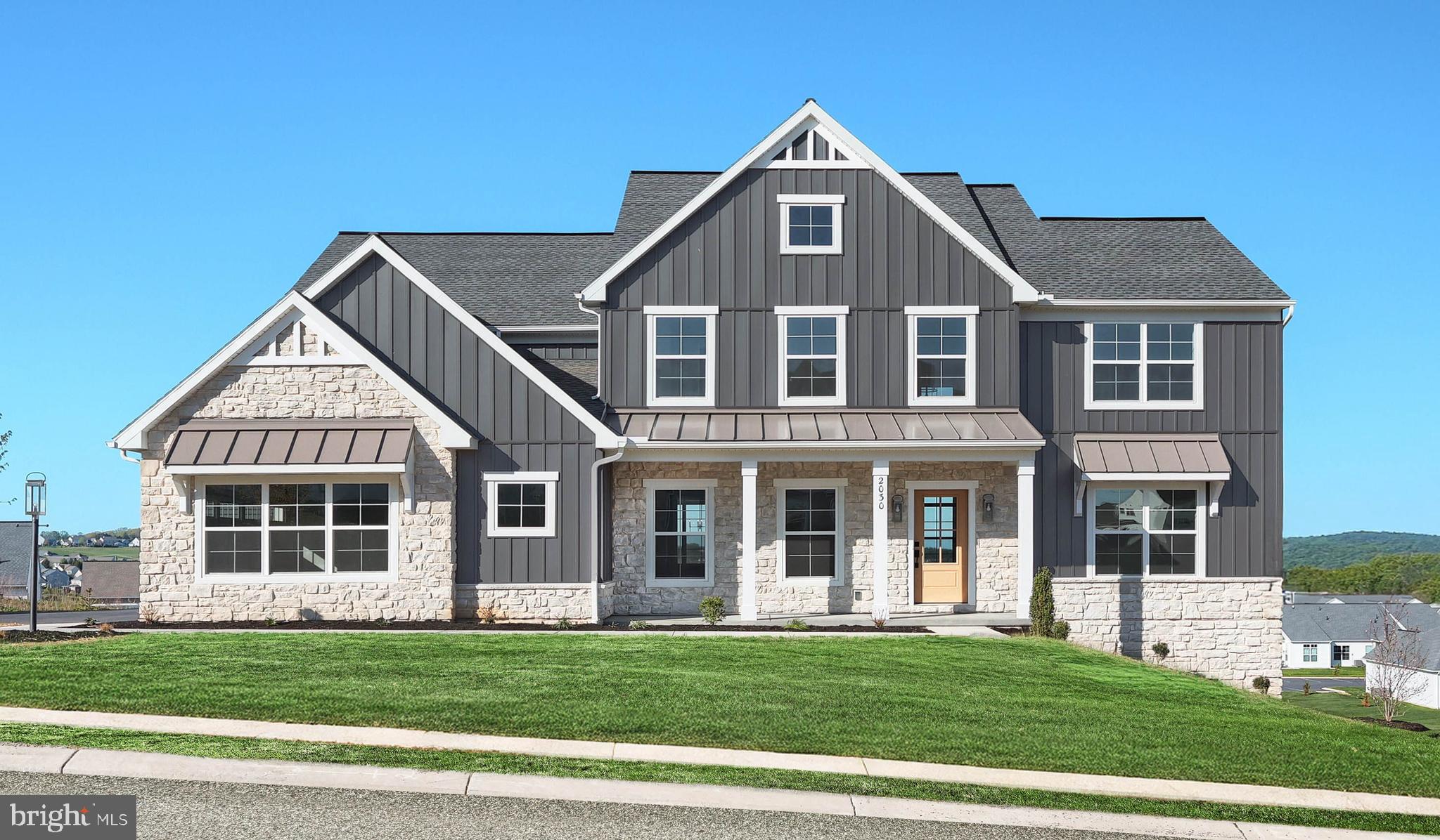 This grand 2-story home features 9’ ceilings on the first floor and basement and a 3-car, side-load garage with mudroom entry. The mudroom is complete with built-in lockers, a powder room, and a large pantry. Upon entering the home, the 2-story foyer is flanked by a formal dining room and a carpeted living room and study. Stylish vinyl plank flooring extends throughout the rest of the first floor. A butler’s pantry separates the dining room from the sweeping kitchen which comes well equipped with enhanced appliances and cabinetry, quartz countertops with a tile backsplash, a wide center island, and a breakfast nook. Sliding glass doors off the kitchen provide access to the deck. The great room is warmed by a gas fireplace with floor to ceiling stone. Take the convenient staircase with access in both the foyer and kitchen to the second floor that boasts a large rec room, laundry room, 4 bedrooms and 3 full bathrooms. The owner’s suite includes a tile shower, a double bowl vanity, and an expansive closet. (The floor plan shown represents the standard layout for this home plan. Actual layout, features, and options may vary. Construction plans take precedence over artwork. Please see the Community Sales Manager for details.)