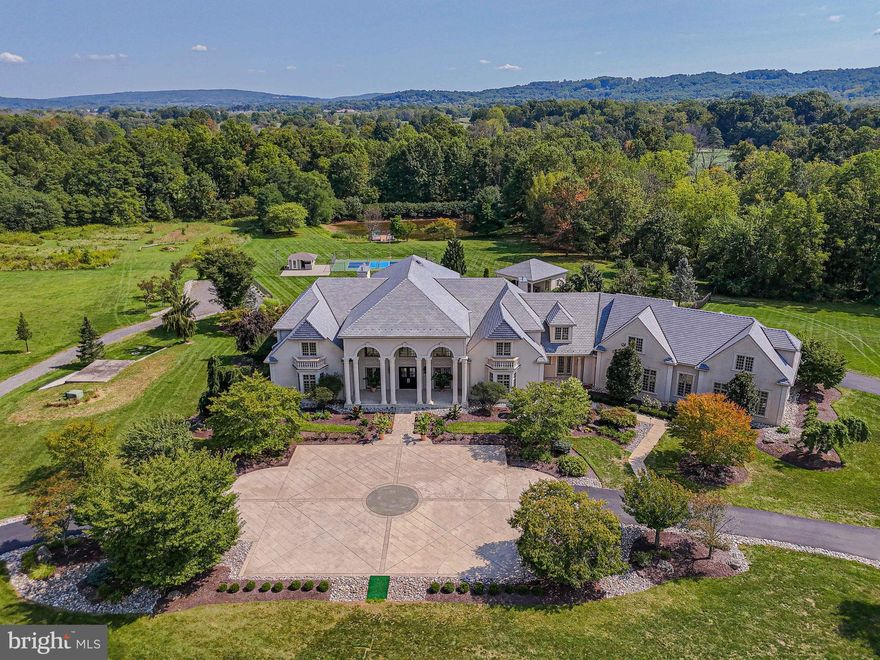 Designed by Scholz Designs of Ohio, this 38+ acre estate, surrounded by Ag preservation, has a climate controlled barn suitable as a horse stable or big toy storage. Details are many. Commercially constructed with steel and hand sculpted columns; the grand entrance begins through double mahogany doors. Home features: 5 bedroom suites,6 full baths,extra space as in-law suite,4 powder rooms, six gas fireplaces ,2 full gourmet kitchens ,Wolf, Sub-zero, Asko, Miele appliances,3 laundries, heated indoor Hydroworx therapy pool, heated outdoor saltwater pool,cabana w/2 full baths,regulation lighted pickleball court and beverage bar,4 car heated garage,Schonbek chandeliers w/electronic lifts,Lutron electronic shades, home scene lighting system,15 seat multi media theater, granite, porcelain, and Brazilian cherry flooring, central vac system ,geothermal HVAC w/backup boilers, full home propane backup generator ,lighted fountain fishing pond w/deck ,UV water treatment system . THIS IS A PRIVATE RESIDENCE THAT CANNOT BE SEEN FROM THE ROAD , PLEASE DO NOT ENTER THE DRIVEWAY WITHOUT AN APPOINTMENT. IT WILL BE CONSIDERED TRESPASSING.