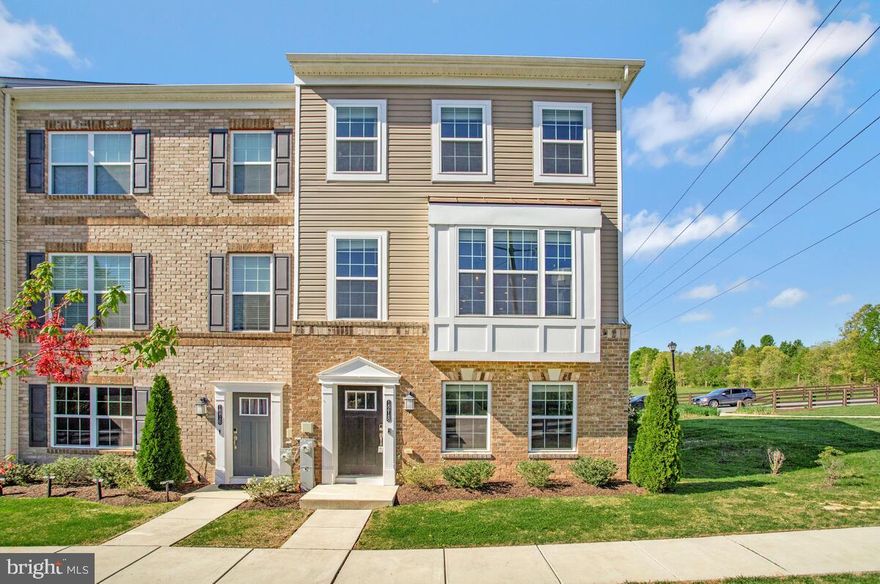 Love where you live! This pristine end unit townhome offers a great place to call home.   The entry level  15 x 19 space allows options-a recreation room, home office or gym.  It also offers  easy access to the two car garage. Head upstairs to find a fantastic kitchen with a tremendous amount of white cabinetry, stainless steel appliances, an island and two places for bar stools.  Open to the family room, you'll love how easy it is to entertain or just relax with family and friends.  With a deck just off the kitchen, enjoy this summer grilling out or sipping your favorite beverage.  On the 3rd level you'll find three bedrooms, two full baths and a laundry room.  The primary bedroom features a walk-in closet with custom California cabinetry and a full bath with double sinks and large ceramic tile walk-in shower with bench. Looking for the perfect spot to unwind, head up to the loft.  This level boasts a beautiful room with cathedral ceiling and a private roof top deck.  It is the ultimate get-away room!
Love the location-Costco Plaza, White Marsh Mall, Eastern Regional Park (athletic fields, indoor multipurpose courts, meeting rooms, nature trails, playgrounds and pavilions) and Honeygo Run Regional Park (athletic fields, dog park, indoor multipurpose/pickle ball courts, meeting rooms, outdoor pickle ball courts, paved walking paths, pavilions, playground)