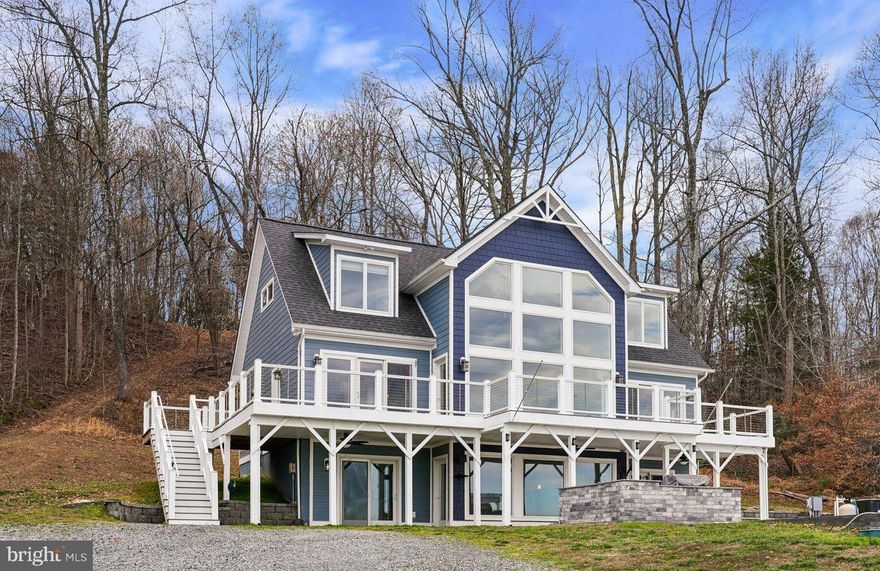 3 Finished Level Custom-built home with absolutely stunning views of both the Potomac Creek and the Potomac River from every room.  Main level features beautiful open floor plan that flows from the large dining area to the huge family room with vaulted 2 story ceiling and gorgeous floor to ceiling windows that showcase the water views! On to the kitchen, perfect with stainless steel appliances, granite counters, large pantry and 42-inch soft close cabinets.  The Main Level primary suite features triple French door to upper deck, luxury bath with dual vanity, separate shower, soaking tub and two walk in closets.  Convenient Powder room, laundry room with full size washer and dryer complete the main level. Upper level has 2 large bedrooms and full bathroom with open hallway that overlooks main level. Amazing, spacious lower level has recreation room with floor to ceiling windows, doors to beautiful patio entertainment area, full bar, additional bedroom, den, utility room, and full bathroom * Gorgeous pine hardwood floors throughout entire home.  Enjoy luxury living outdoors in your heated in-ground Gunite pool with custom cover surrounded by fabulous stone patio featuring complete cooking station with grill and ice machine and is pre-wired for a hot tub. Overlooking the beautiful pool and patio is your maintenance free wraparound deck, the perfect spot to relax and appreciate the peaceful surroundings. You’ll love the gigantic two-car detached garage featuring front and back drive through doors for easy boat storage.  Boaters will appreciate the shared dock with a 13,500-pound boat lift which can accommodate a 30-foot boat. The calm shoreline waters make it ideal for boating, fishing and kayaking!