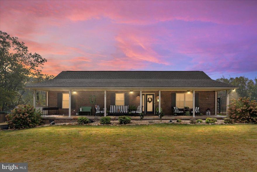 Set across 2.5 acres, this property offers a rare sense of calm, where space, privacy, and thoughtful design come together in a way that feels both intentional and inviting.

The main level spans 1,904 square feet and features three Bedrooms and two full Baths arranged in a layout that supports comfortable, everyday living. Natural light moves easily throughout the home, and the connection to the patio and outdoor spaces creates a seamless flow for quiet mornings or relaxed evenings with family and friends.

The fully finished lower level adds an additional 1,904 square feet and functions as a space for a loved one or it could provide extra income as a rental. It is complete, with one Bedroom, one full Bath, a full Kitchen, separate Laundry hookups, and its own exterior entrance with driveway access. Designed for independence without separation, this space offers flexibility for family, guests, or long-term living arrangements.

Outdoors, the property invites a slower rhythm of life. An in-ground pool with a tranquil waterfall feature anchors the backyard, offering a peaceful setting for entertaining or unwinding. The grounds also include a greenhouse, raised garden beds, a chicken coop and run, and two storage buildings, supporting a small-scale homestead lifestyle while maintaining comfort and convenience.

With multiple living spaces, usable acreage, and features that encourage both gathering and retreat, this home offers more than square footage—it offers room to breathe, space to grow, and a setting designed to be enjoyed over time.