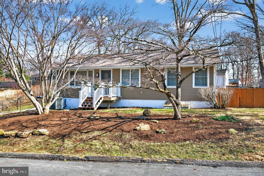 Located just minutes from the shops, restaurants, and waterfront charm of downtown Annapolis, this beautifully renovated rancher offers the perfect blend of modern updates and comfortable living. The main level features stunning hardwood floors, three bedrooms, and a fully renovated bath. The open-concept kitchen showcases stainless steel appliances, granite countertops, and flows seamlessly into the living area—ideal for both everyday living and entertaining guests. Need additional space? The fully finished walk-out lower level offers a spacious recreation area, a full bathroom, plus a laundry room and additional storage. Step outside to relax on the deck overlooking the generous backyard—perfect for outdoor dining, gardening, or gatherings with friends and family. Ideally located for commuters, the home offers easy access to U.S. Route 50 while still being close to all the dining, shopping, and waterfront activities that make Annapolis such a sought-after place to live.