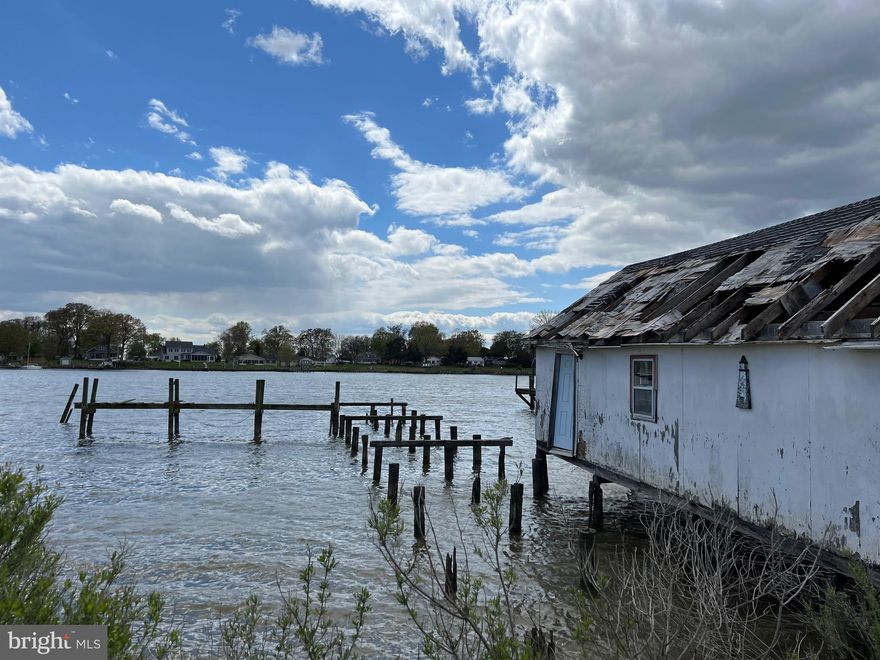 Unique waterfront property with a repairable pier and over-the-water Waterman's storage building with electric service. Lot is approx. a quarter of an acre.