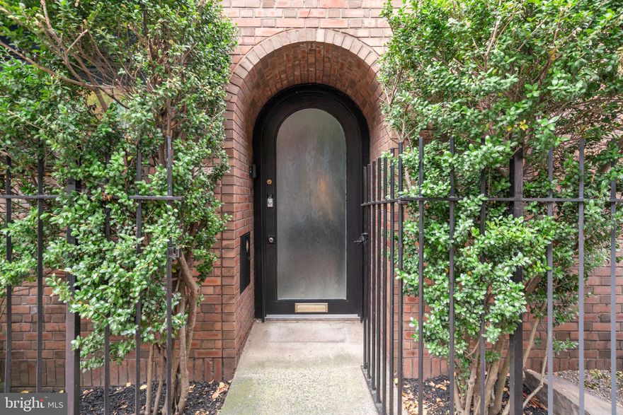 Step into this exquisite Society Hill townhome, designed by the internationally renowned architect I.M. Pei.  The entrance welcomes you with natural stone flooring, transitioning to maple hardwood, leading to a gourmet kitchen on the left. The kitchen features high gloss wood cabinetry, a quartz countertop, and professional-grade appliances, including a Miele gas burner stove and a Liebherr stainless steel refrigerator. Enjoy your morning coffee in the cozy breakfast nook adjacent to the kitchen, complete with closets for ample storage.  The living room is a serene retreat with a wall of windows that overlook a tranquil brick patio, embodying biophilic design principles.  For your convenience, a powder room is also located on this floor.  Ascend the iconic circular staircase to the second floor, where you'll find a study with a wood-burning fireplace, custom built-ins, a 9 foot ceiling, and a large custom window offering views of historic 3rd Street homes, including the residence of Philadelphia's first mayor.  This floor includes an updated full bathroom with a glass-enclosed stall shower and a spacious rear bedroom.  The third floor has two additional bedrooms, each with large closets and two modern full bathrooms with skylights.  The finished basement offers a versatile space, perfect for a home gym, media room, or additional storage, and includes a laundry area. Gated parking for one car is available directly behind the home in the association lot.  Located in a historically preserved neighborhood, this home is surrounded by enchanting green spaces such as Three Bears Park, Independence Park, and the upcoming 11.5-acre park from the I-95 capping project.  Enjoy a short walk to a myriad of fantastic restaurants, cafes, the Ritz and PFS theaters, and a quick 15-minute ride to the airport.