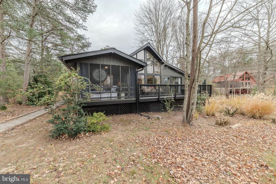 Welcome to this delightful Chestnut single-family home, all on one level, situated on Tecumseh Trail. As soon as you step inside, you'll notice numerous upgrades throughout. These enhancements include new insulation beneath the entire home, updated flooring, a brand-new kitchen, a renovated laundry room, and new cabinetry flanking the fireplace. The roof is just a year old, and there are new gutters and downspouts. Both the interior and exterior have been freshly painted, and a propane tank has been added for the dual fuel stove. The guest bathroom has been remodeled, and new lighting fixtures have been installed throughout the house, along with replaced interior doors. This property is conveniently located within walking distance to the outdoor pool, Pro Shop, driving range, practice/putting sand trap area, and the Clubhouse Grille. Enjoy the 12x10 screened porch and the 28x10 open deck that offers beautiful views of the golf course. Additionally, there's a detached 24x24 two-car garage. Don't miss out—this property is a must-see!