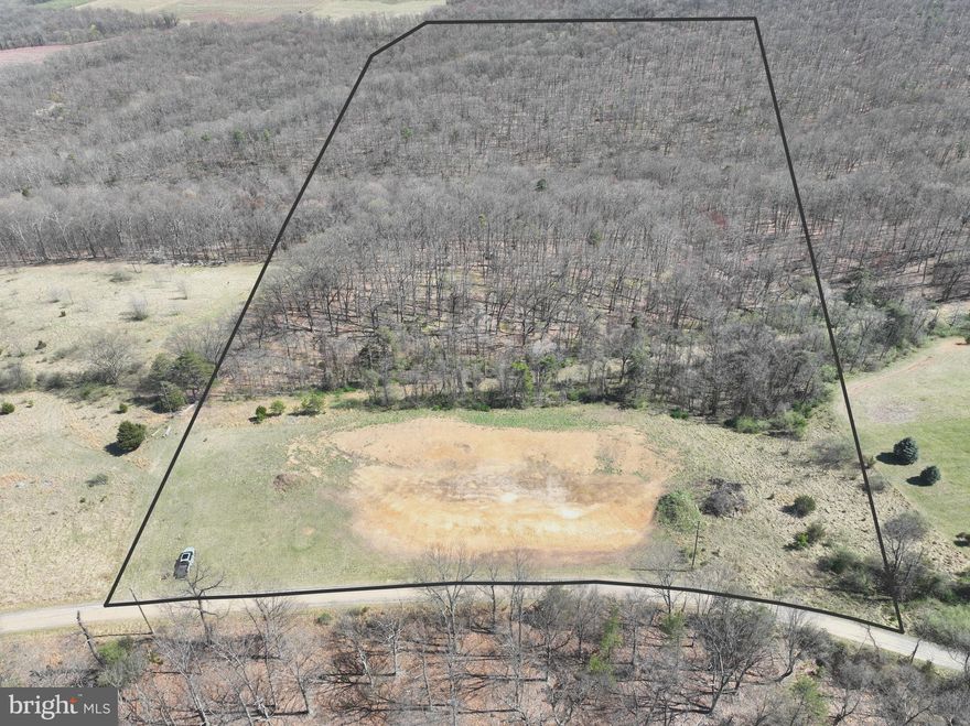 Welcome to 24.55 acres of pure West Virginia gold, tucked away in the quiet, laid-back development of Patterson Estates — where the restrictions are just enough to protect your investment, without getting in the way of your freedom. Located just outside the mountain town of Romney, WV, and less than two hours from the chaos of Washington, D.C., this property offers the perfect balance of rugged seclusion and practical accessibility. The land itself is everything you'd want in a mountain retreat — a beautiful mix of flat ridgelines and secluded hollows, draped in towering mature timber and teeming with wildlife. Whitetail, turkey, even the occasional black bear — they all call this place home. Whether you're building a hunting basecamp, weekend cabin, or full-time dream home, this tract is ready to roll. The build site is already cleared, the driveway is in, there's a drilled well on-site, and the property has a clean perc approval in hand. To top it off, a fully enclosed hunting blind is already in place, so you can hit the ground running — or sit quietly and wait. This isn't your average lot. It's land with character, purpose, and potential. Whether you're looking for solitude, recreation, or a place to build your legacy, this 24.55-acre piece of Patterson Estates delivers. Come claim your slice of West Virginia — where the air is clean, the neighbors are few, and the possibilities are wide open.