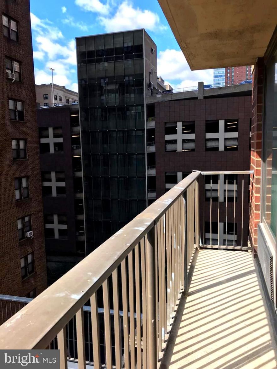 Fully renovated one bedroom boasting southern city views from a large private balcony! Unit 7L at the Academy House features beautiful appointments throughout, including new hardwood floors, large bay windows and generously sized rooms. Enter into a foyer with extra storage space that leads to the sun-soaked living and dining room. The living room features a wall of sliding glass doors that lead to a tremendous French balcony overlooking the Kimmel Center. Adjacent, the fully renovated kitchen has white shaker cabinetry with brass drawer pulls, neutral granite countertops, white/brown subway tile backsplash, an oversized sink and stainless steel appliances. The spacious bedroom enjoys use of a wall closet, walk-in closet and nearby full hall bathroom. The bathroom is updated with white subway tile flooring, a shower/tub, an oversized single vanity with granite countertop, and a utility closet with a stackable washer/dryer. Residents of Academy House enjoy a 24-hour doorman and a brand new, state-of-the-art fitness and aquatic center. There is valet parking in the building's garage for an additional monthly fee, subject to availability. The Academy House is located in the heart of Center City and within close walking distance to Rittenhouse Square, Washington Square, and the Broad Street and Market Street office corridors. The Philadelphia International Airport and Amtrak's 30th Street Station are easily accessible.
