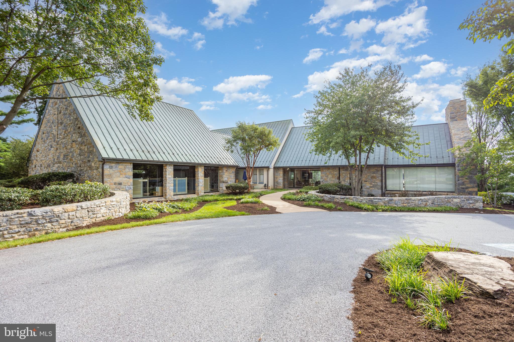 1910 Harrington Drive is an architect-designed work of art. Purposefully planned to foster a serene connection to nature, the three-story office building is filled with natural light and green views, creating an efficient, flexible floor plan that fuels creativity and leaves a memorable first impression for clients and staff alike. Set just off Route 30 and Fruitville Pike, the property delivers quick regional access yet feels worlds away thanks to a mature tree canopy and lush landscaping. The quiet, natural backdrop softens the workday and offers privacy for employees and visitors, while ample surface parking and a campus-like setting provide everyday convenience in the heart of Lancaster’s Manheim Township. The ±15,290 SF building is zoned Business District (B-1) in Manheim Township and features floor to ceiling windows, 16 private offices plus one semi-private office overlooking the "bullpen" area, two conference rooms, multiple large meeting or training areas, nine restrooms, breakrooms and kitchenettes throughout and a CEO office with wet bar. An on-site storage building with a finished interior is not included in the listing sq. ft. 49 on-site parking spaces serve staff and guests. A rare opportunity to blend thoughtful design, functionality, and location in one exceptional workplace. It is possible to sublet a floor, or separate departments, since all 3 levels have a private exterior entrance, if desired.