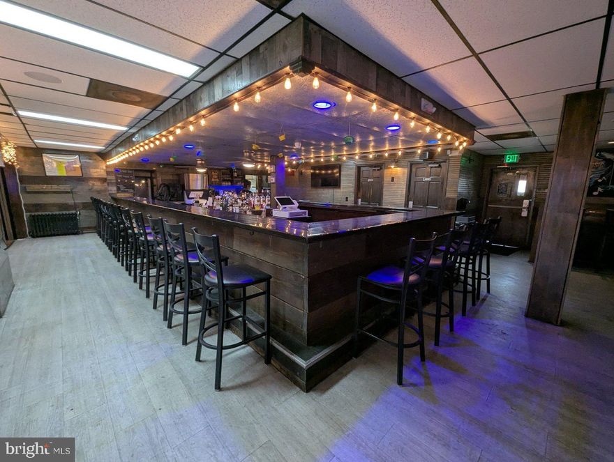 Discover a rare opportunity to own a well-known and beloved landmark. This unique property blends history, charm & business potential, making it ideal for investors, restaurateurs, or any end user seeking to own a piece of local legacy. 

🏡 Property Highlights:
Historic Structure with rustic charm and timeless appeal
Ample Indoor Space featuring multiple dining areas, bar/lounge, kitchen, and flexible floorplan
Outdoor Patio & Deck perfect for live music, events, or seasonal dining
Prime Location with high visibility and over 20,000 vehicles per day passing the 350' of frotnage on Philadelphia Rd
Within walking distance of the Gunpowder River and Gunpowder Falls
Ample Parking on-site for guests and staff with over 65 parking spaces and room for more
Versatile Zoning allows for bar/tavern, restaurant, event space, or redevelopment opportunities

For decades, The Big Falls Inn has been a favorite local watering hole and gathering spot—well-known for its character, strong community ties, and proximity to hiking trails and riverfront recreation. Whether you're looking to maintain its current glory, reimagine the space, or develop a new concept, this is your chance to make a mark.

This turnkey venue features a spacious 4,589 sqft building, two outdoor pavilions, one for pit beef (about 1,100 SF) & one for entertainment about 1,200 SF), and holds a very rare 7 day Class B beer, wine liquor license (transferable upon approval) 

Inside you'll find a fully furnished bar area with high top tables, pool tables, refrigeration units, and walk in coolers. The commercial kitchen comes outfitted with gas stoves, fryers, sandwich stations, slicer, electric oven, and all necessary prep equipment . The property includes an upstairs office and full bath, plus an unfinished basement with utilities. HVAC includes oil radiant heat and central air; there’s ample paved parking for 65 cars, plus auxiliary overflow for 20–30 more vehicles 

All fixtures, furnishings, and equipment are included in the sale (excluding jukebox and ATM), making this a truly plug and play venue perfect for hospitality entrepreneurs or investors. In addition to the real estate, the business, that has grossed almost a million dollars annually in the past, must be purchased and is listed on BizBuySell for only $325,000.

This opportunity combines a fully operational restaurant, bar/tavern and music venue with a valuable real estate asset and is ideal for entrepreneurs, restaurateurs, investors, or developers seeking an established property with expansion potential. The property has a rustic charm and neighborhood feel, making it a staple for locals and visitors alike. Its versatile layout and outdoor amenities allow it to host regular dining, live music events, community gatherings, and catered functions. 

Investment Highlights
     Turnkey Operation – Fully equipped and ready for immediate operation
     Outdoor Revenue Potential – Expand outdoor dining or event programming
     Rare Liquor License – Transferable 7-day license is highly sought-after in Baltimore County
     High Visibility Location – Located directly off Philadelphia Road with steady traffic flow
     Flexible Use Zoning – Property can support various hospitality and entertainment concepts
     Strong Local Following – Legacy name with room for branding and marketing growth

Opportunities for Buyers
Owner/Operator: Perfect for experienced hospitality professionals looking to take over an active venue
Investor: Ideal for investors seeking real estate-backed cash flow and value-add upside
Developer: Prime acreage with redevelopment potential for hospitality or mixed-use applications

This may be your only chance to unlock an exceptional opportunity at Big Falls Inn, a fully equipped bar and restaurant on a 3.61 acre parcel that is in "like-new" condition.

SHOWINGS AVAILABLE ALL DAY MONDAYS OR WEDNESDAYS UNTIL 4 PM