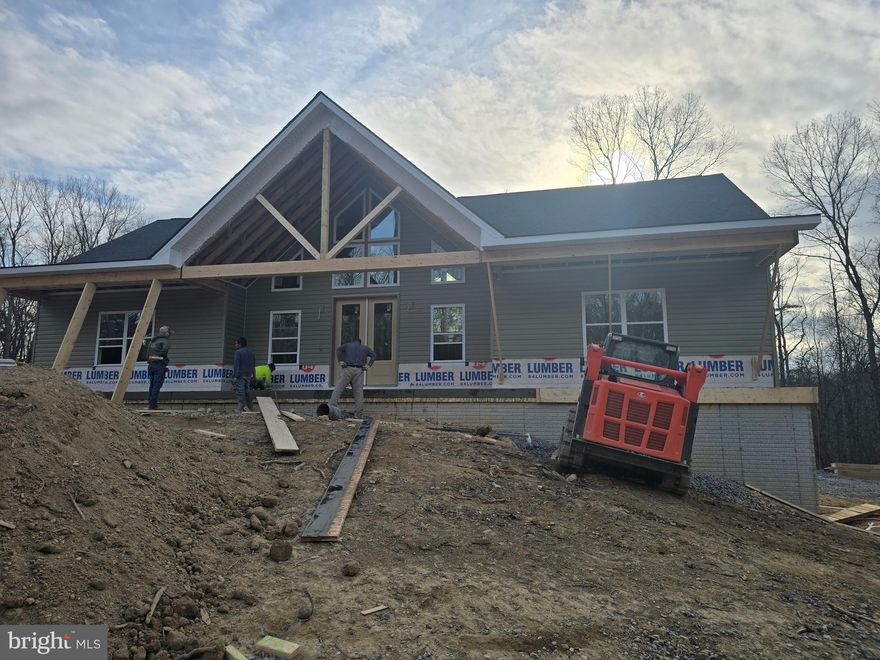 March 2026 completion on this great offering located on a sprawling 20 +/-acre lot, this charming ranch-style home is waiting for your furnishings to call it home. This property offers a unique opportunity for dream residence in a serene, wooded setting. The home features a thoughtful design that seamlessly blends comfort and functionality, making it an ideal retreat for those seeking tranquility. Step inside to discover a spacious layout that includes four well-appointed bedrooms and three and a half bathrooms. The heart of the home includes a cozy gas fireplace, perfect for those chilly evenings. The kitchen is equipped with modern stainless steel appliances, including a built-in microwave, dishwasher, and electric oven/range, ensuring that meal preparation is both efficient and enjoyable. The main floor laundry adds convenience to your daily routine, while the expansive basement offers endless possibilities for additional living space, complete with a connecting stairway and outside entrance. Imagine transforming this area into a game room, home gym, or even a cozy guest suite. Outside, the property is a nature lover's paradise, backing up to lush trees and offering a peaceful view of the woods. The sloping terrain adds character to the landscape, making it perfect for outdoor activities such as hunting or simply enjoying the beauty of nature. A spacious 12 x 18 composite deck invites you to unwind and soak in the serene surroundings, while the pole barn provides ample storage for your outdoor equipment or hobbies. Parking is a breeze with an attached garage that accommodates two vehicles, along with additional driveway space for guests. The excellent condition of the property ensures that you can move in with peace of mind, knowing that quality materials have been used throughout, including batts and blown-in insulation for energy efficiency. Located in a tranquil area, this home offers the perfect balance of privacy and accessibility. Enjoy the benefits of rural living while still being within reach of local amenities, shopping, and recreational opportunities. This property is not just a house; it's a place where memories will be made, and a true sense of home will flourish. Embrace the opportunity to create your own sanctuary in this beautiful setting with over 22,000 acres of Sleepy Creek lake & forest just down the road.
But that's not all. 30  X  30 pole barn with concrete floor lights  included for all your gear and toys!