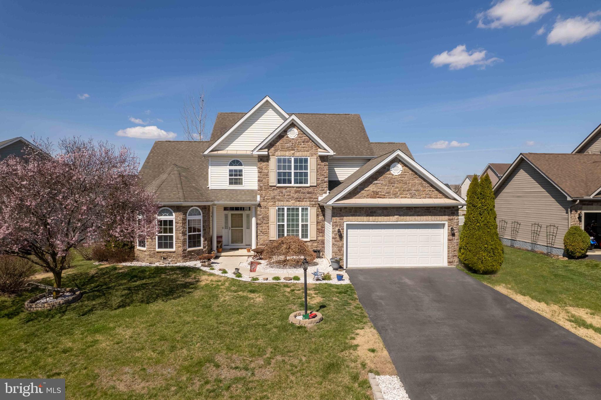 This gorgeous property located at 199 Shannon Ct, Inwood WV is a rare find with a one-level master bedroom featuring an ensuite bathroom. The main level of the home offers a spacious living area with two-story ceilings, a stunning stone fireplace, and gleaming hardwood floors. The well-appointed kitchen, equipped with stainless steel appliances, is perfect for entertaining guests. A staircase leads to two additional bedrooms and a well-designed bathroom on the upper level. The fully finished lower level boasts yet another full bathroom with 3 bonus rooms that are currently used as guest bedrooms and a walk-up rear exit to the backyard. The home also features a beautiful patio and deck, ideal for outdoor entertainment, and a flat yard. The 2-car garage and paved parking ensure ample space for vehicles, while the cul-de-sac street provides a peaceful, low-traffic environment. Commuting is a breeze with easy access to I81 South to Winchester VA, North to Hagerstown MD, or Rte 340 to Northern Virginia. The handsome exterior, crafted with stone and vinyl, exudes charm and sophistication. Don't miss this opportunity to own this stunning property with a one-level master suite and plenty of entertainment space.