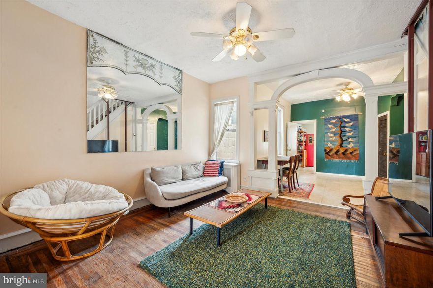 Welcome to this extra spacious three bedroom South Philly home, featuring just the right amount of original charm plus room to customize and update as you go. The main level has three bright living spaces with original hardwood floors in two. There’s room for a living room, formal dining room plus home office or library. A series of archways connect the rooms and also provide decorative nooks/bookshelves. The open concept kitchen at the rear has a custom-built wood counter with retro-cool tile floors. Mimic the current-upcycled storage set up or revamp the kitchen entirely for a more modern look. There are three spacious bedrooms upstairs, all with hardwood floors, large windows and good closet space. There’s a hall bath with black and white tile tub  surround. There’s an additional full bath in the large finished basement which also has a marbled tile shower surround and a white vanity. Out back is a patio for grilling and container gardening.  Dickinson Square and Mifflin Square Parks are close by for additional greenspace. Commuters will appreciate the access to I-95 and local favorites include the Bok Building with an array of small businesses and restaurants. Don’t miss the opportunity to make this home your own!