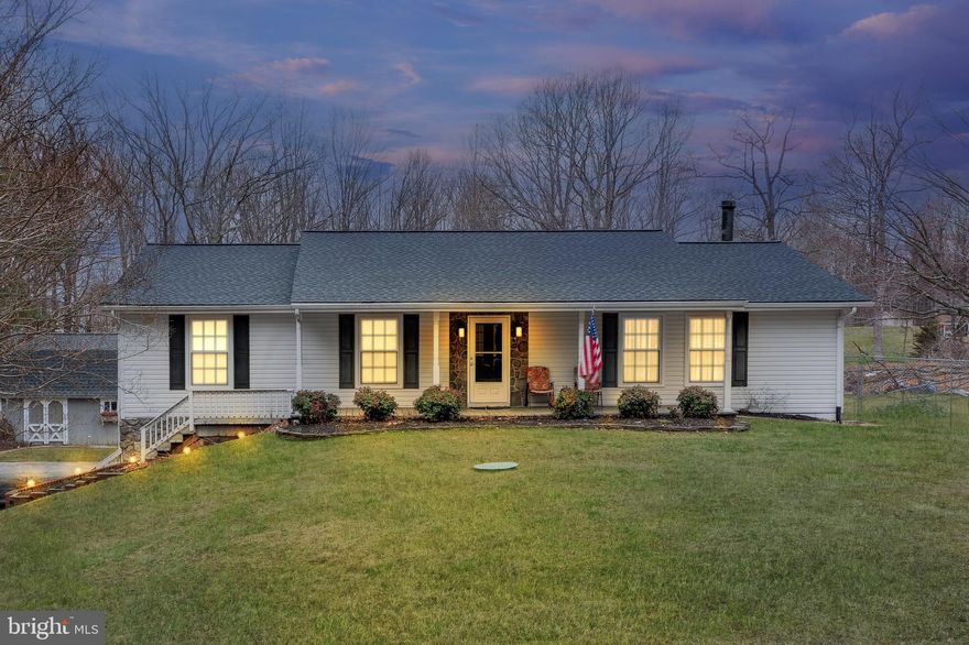 This stunning property located at 50 Mason Lane in Stafford, VA, offers 1.74 acres of private, wooded land and 3,674 sq ft of living space. The home features 4 spacious bedrooms and 3 full bathrooms, with a fully finished lower level that includes a complete in-law suite and 2 additional rooms in the basement. The suite includes its own full kitchen, living area, and bedroom, with a separate entrance for privacy and convenience, making it perfect for multi-generational living or potential rental income. The expansive backyard provides the perfect space for outdoor activities and relaxation, with plenty of room for gardening or enjoying the peaceful surroundings.

Inside, the home boasts beautiful hardwood flooring in the main living areas and plush carpeting in the bedrooms. Updated appliances, including stainless steel options, were installed in 2018 or later, enhancing the home's modern appeal. The home offers dual heating systems on the upper level—one with oil and the other with electric—providing flexible and efficient climate control. The downstairs has its own dedicated heating unit with oil. There is a dual AC unit, which runs on electric, and features separate controls for the upstairs and downstairs to ensure comfort throughout the home. Additionally, the backup automatic propane system runs heat throughout the entire home, with the propane system tested every Tuesday to ensure its reliability. The recently rebuilt oil furnace (2023) and dual water heater replaced in 2024 provide further comfort and efficiency.

The property also features a beautifully remodeled deck with a screened-in section and LED lights, perfect for outdoor dining or enjoying the serene landscape. With an attached garage and ample parking, the home provides plenty of space for both residents and guests. Situated in a no-HOA community, this property offers freedom and flexibility while being conveniently located near local amenities, schools, and major commuter routes. This home is truly a must-see for those seeking a spacious, functional, and private retreat in Stafford.