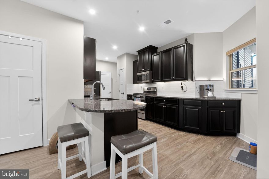 Welcome to The Woodlands, Urbana Maryland's coveted 55+ community! And welcome home to this lovely villa situated in a prime location in the neighborhood--walk to the Dog Parks, Pavilion, Clubhouse, beautiful pool and pickleball and bocce courts, and community garden shed!   As you step inside, you'll be greeted by the expansive open concept design seamlessly connecting the kitchen, dining area, and living room. The chef's kitchen boasts high-end finishes, modern appliances, and ample counter space, making it perfect for entertaining and everyday living. In the rear of the home, the sunroom offers versatile space for your relaxation and   the perfect spot for your morning coffee. The main level also features the serene.  Additionally, you’ll find a convenient half bath and laundry room, ensuring everything you need is on one level. Venture upstairs to discover two generously sized bedrooms, a full bath, a finished storage area, Don’t miss your chance to enjoy upscale living in this vibrant 55+ community! Schedule your  tour today