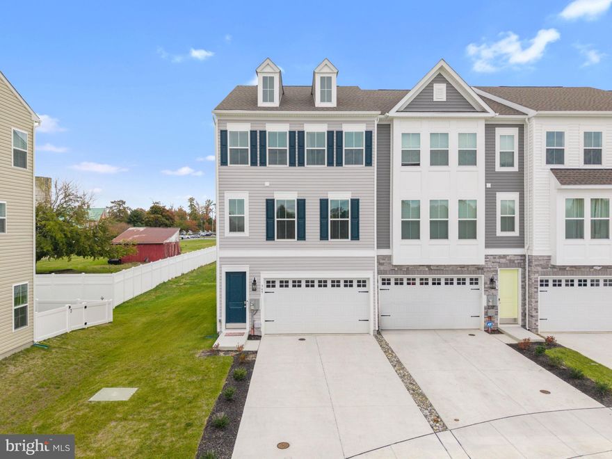Welcome to 365 Andrew Ct! 
This beautifully maintained, like-new home offers all the advantages of new construction without the wait. Nestled within the highly acclaimed Appoquinimink School District, this stunning end-unit townhome combines luxury with convenience. Featuring an expansive open-concept floor plan, this home is tailored for modern living. With 3 bedrooms, 2 full baths, 2 half baths, and a 2-car garage, there’s ample space for everyday life and entertaining. The chef’s kitchen is a standout with upgraded cabinetry, Quartz countertops, a stylish tile backsplash, and GE stainless steel appliances, seamlessly flowing into the dining area and great room. The lower level, currently used as a bedroom, offers versatile options for your needs. It could easily serve as a home office, gym, playroom, or guest suite. Luxury finishes throughout include LVP flooring on the main level, upgraded tile, and elegant details that enhance the home’s appeal. No need to wait for construction; this home is move-in ready in a community where opportunities like this are truly rare!