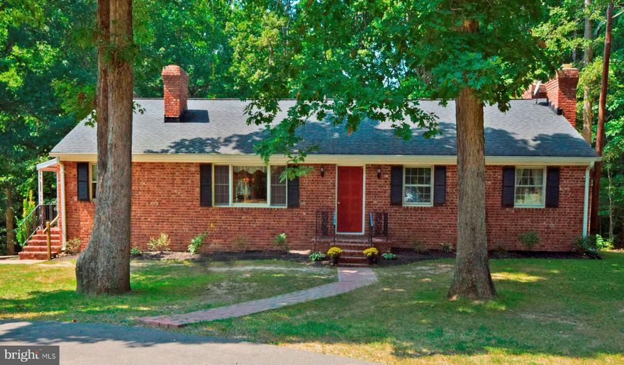 History is here.Civil War trench in front & all bricks from old JW Masters downtown Fredericksburg.Interior offers wood floors,new carpet,fresh paint,upgraded baths w/ceramic & 5 f/p's.In-Law Suite fully equipped with complete eat-in kitchen,living room and 5th bdr/ntc.Exterior offers two car oversized garage,large concrete pad,cir. paved drive with ext. to the rear. 1.88 acres/no HOA w/privacy.