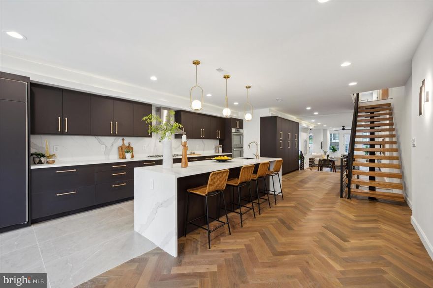 Nestled in the heart of Fitler Square, 2037 Locust Street combines all the character of a historic home with updates that support your modern lifestyle. This stunning 4 bed, 4.5 bath property features unique architectural details, meticulously selected finishes, and thoughtfully designed spaces that create a seamless flow for everyday living. The first floor welcomes you with a living space and half bath as well as a bedroom with a private full bath — perfect for an au pair or inlaw suite. The beautifully designed kitchen, featuring an overabundance of cabinets, shares the second floor with the dining room, sitting room, and a charming balcony perfect for morning coffee or a good book. Two very large bedrooms, both of which have private baths and ample storage, make up the third floor along with a laundry room. The fourth floor is where you’ll find the final bedroom, a living space with a wet bar, and a full bath before heading out to the rooftop deck built for entertaining as well as impressing with its sweeping city views. The finished basement provides even more living space in this generously sized home. Conveniently located near Fitler Square Park, gyms, restaurants, shops and more, this home is designed to allow you to take advantage of all the greatest parts of city living.