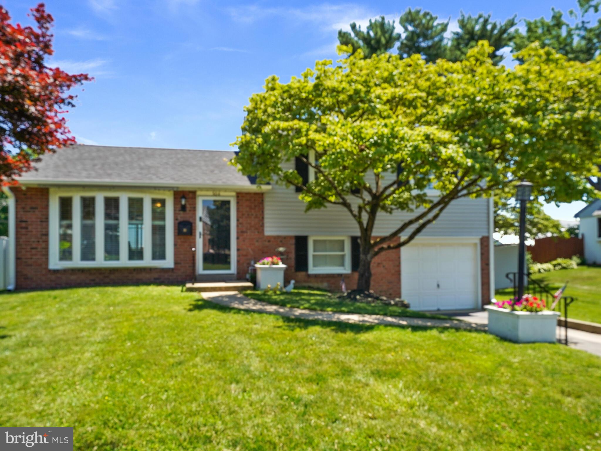 Welcome to this well maintained home with loads of updates! Custom Hardwood Flooring and Plantation Shutters  t/o. Spacious Living room with ceiling fan , formal dining room with open granite counter to  kitchen, updated eat-in kitchen with oak cabinets, recessed lighting, granite counters and gas cooking. Second floor master bedroom has powder room, two other bedrooms, updated full hallway tile bath. Lower level family room, large bright laundry and utility room and powder room. Door leads to fenced spacious yard. One car garage and driveway. Shed has electricity and has been used as a woodworking shop. Amenities include hardwood floors throughout, plantation shutters, replaced windows, master bedroom with powder room. New Whole House Generator. Roof is only 3 years young, fence just 1 year. Easy access to Routes 1, 320 and 476. Next to Springfield CC, and close to shopping. Close to Springfield Mall and other Major shopping centers.