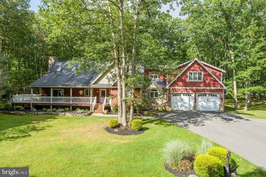 Lake Access Craftsman located in the sought after Blakeslee Community! This 4Bed 4Bath luxury lake home features a wide open living area with vaulted ceilings, fully modern kitchen with stainless appliances, granite tops and island bar seating, and an oversized two car garage with a bonus room above. Stacked stone fireplace centered in the great room is ideal for gathering in the cold winter months, or stretch out on your sprawling wrap-around deck, that offers plenty of open or covered space to relax and soak in the fresh mountain air. Abundant natural light in the main living area that opens to a loft with 2 Bedrooms and a shared bath on the second floor. Main level primary suite with fully tiled shower, walk-in closet and double bowl vanity. Just across the street from the community lake access with your very own dock slip! Situated on 1.2 acres of wooded land, this home provides a true mountain lake experience, with all the modern comforts of home. Access to community pool, tennis courts, trails, soccer field and more - The Blakeslee is perfect for year-round living, vacation rental, our your personal oasis at Deep Creek Lake. Call today for your private showing!