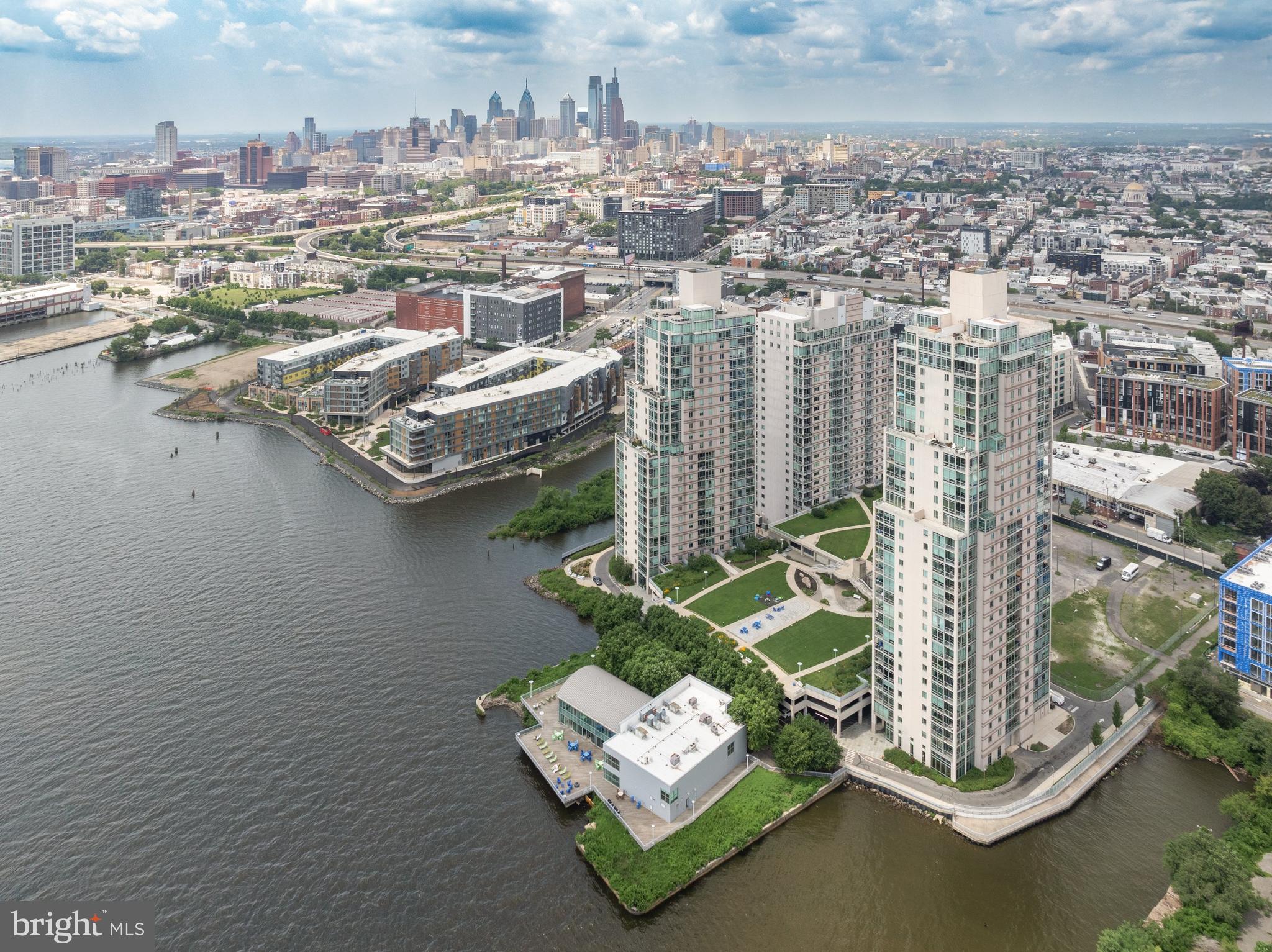 Exquisite and once-in-a-lifetime opportunity to own the largest penthouse home at Waterfront Square, Philadelphia's premier gated Waterfront Community. This extraordinary 5-bedroom, 7- bathroom residence has been completely reimagined-stripped to the studs and rebuilt with timeless elegance and craftmanship.Every inch of this home reflects meticulous attention to detail and uncompromising quality.
Enter your private oasis directly from your elevator in a sun-drenched open-concept layout featuring stunning imported Brazilian tile throughout. With 360-degree views of Center City, the Delaware River, the Ben Franklin Bridge, and beyond, this sky-high sanctuary offers one of the most breathtaking vantage points in all of Philadelphia.
The custom kitchen is a chef's dream with state-of-the-art appliances, sleek cabinetry, and expansive quartz countertops. Each bedroom is a private retreat with spa inspired en-suite baths, and the primary suite is a masterpiece of comfort and design Designer lighting, smart home technology, and high -end finishes are seamlessly integrated throughout.
Furniture is included in the list price-just bring your personal items and begin living your dream. With over-the-top luxury and space rarely found in condo living, this "pie in the sky" penthouse redefines elevated city life.
Waterfront Square offers 24/7 concierge and security, state-of-art fitness center, indoor pool, sauna, shuttle service and a riverfront walking path. Experience one of Philadelphia's newest and most vibrant neighborhoods-located in Northern Liberties yet minutes from Fishtown and Center City.
Don't miss your chance to own a true Philadelphia landmark in the sky.