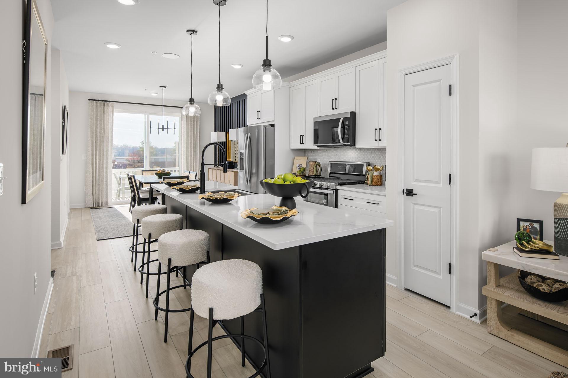 Most affordable new townhomes in the heart of Montgomery Village – Furnished Model Home now available to tour!
Welcome to the Abbey—an open-concept townhome that blends modern style with everyday convenience. Designed for flexibility and comfort, this home offers bright, functional spaces and thoughtful features throughout.
• Two ways to enter – through the inviting main entry or via the rear-load 1-car garage
• Spacious recreation room on the entry level, perfect for a media space, home office, or the option to convert into an enclosed bedroom with full bath
• Light-filled main living level featuring a sunny family room with sliding glass doors for future deck access
• Well-appointed kitchen with a generous center island, ample cabinetry, and a separate dining room for both casual and formal meals
• Two large upper-level bedrooms, each with its own bath and generous closet space
• Separate laundry room on the upper level for convenience
• Modern finishes, open flow, and the ability to personalize to your lifestyle
Tour the Furnished Model Home to experience firsthand how the Abbey combines style, comfort, and functionality in one beautiful package.
*Photos may not be of actual home. Photos may be of similar home/floorplan if home is under construction or if this is a base price listing.