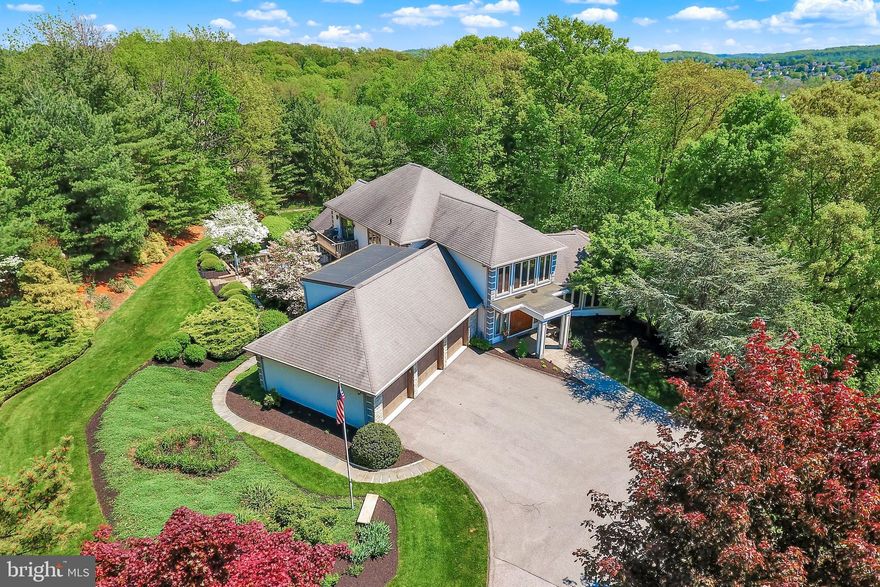 Sitting on a private cul-de-sac in Heritage Hills within the sought after Dallastown
school district, this 7,826 sq. ft. Alan Deamer designed home with five large
bedrooms, four full and two half baths and six garage bays, sits on an impeccably
landscaped 3.75 acres. The exterior includes extensive no-maintenance Trex
decks surrounding the house on multiple levels with an inground heated pool,
cabana, gazebo, volleyball court and a whole-house generator. Three of the six
garage bays (one RV sized), are in a 1,100 sq. ft. detached building which also has
a full one-bedroom apartment situated above the garage bays. In addition to the
5 bedrooms in the main house, the highly customized interior includes a dramatic
two story entry with a custom open stairway, formal living room, dining room,
family room, game room, laundry room, office, gourmet Thomas Kling kitchen,
breakfast area, multiple glass fireplaces (natural gas) and a stunning indoor
heated pool and sauna / steamer. Both the indoor and outdoor pools include
automatic (key protected) safety covers to protect your family. The expansive
master suite includes a 4-sided gas fireplace, large sitting area, multiple walk-in
closets and two separate balconies overlooking the beautiful and professionally
landscaped grounds. The recently renovated master bath includes a large walk-in
shower, a double sized jacuzzi tub, and large double vanities. This home has been
impeccably maintained by the current owners and includes: new professionally
installed roofs on the main house and the detached garage apartment (12/2022),
new roofs on the pool cabana and pool gazebo (7/2020), new tile and lighting in 3
bathrooms (12/2022), new boiler (2022). The sweeping circular driveway on this
resort level home was built to last using commercial grade asphalt. This amazing
home with beautiful views from every room was designed with privacy, leisure
space and security in mind. The home appraised above purchase price. Call soon for a
private showing.