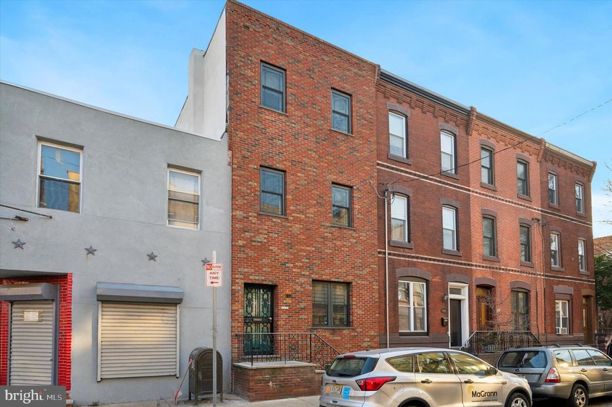 Welcome Home to 1302 Federal Street and immerse your self into the Passyunk square neighborhood !  
This custom built home has has been renovated top to bottom with state of the art features while honoring design elements of the past.     As you step in, you will notice the original foyer details that lead to a wonderfully designed open concept 1st floor that will take your breath away.   The living room full of ample  space for entertainment and enjoyment, features custom built Oak entertainment center with long modern floating shelves and a double sided gas fire place that can be enjoyed from  anywhere on the first floor.  As you continue through the first floor you will notice a convenient  powder room as well as an expansive dinning and bar area.  As you enter the kitchen you will feel warmth  on your feet with the luxury of hydronic radiant floors under beautifully curated Norwegian tile.    Custom Walnut Millwork surrounds the perimeter of this chefs kitchen that feature top of the line Thermador appliances and Brizo plumbing fixtures. As you continue up the stairs you will certainly take notice of the modern cable hand rail with custom stained oak.  As you enter the main bedroom you will instantly relaxed by the comfort and convivence of the large bedroom and walk in closet hidden by a barn style door.  Explore further and you will find a custom ensuite that features a luxurious custom shower with teak wood double vanity and frameless glass surround .  As you make your way back to the main hallway you will notice a convenient hallway bathroom with two more bedroom with tons of natural sunlight.  Two more sizeable bedrooms await you upstairs that is perfect for a office, workout room, or playroom.  As you step outside the backdoor of the kitchen, you will be transformed by the peaceful serenity of one of the largest back yards you will see in the neighborhood.  At over 2400 square feet, this home is truly one of the largest rowhomes you will find in all of Philadelphia.  With the convenience of the train for center city or stadium  access and the culture and convivence of the the Passyunk square neighborhood, 1302 Federal street is a ideal location and not be missed.  Make your appointment today!
Owner is a PA licensed Sales person
