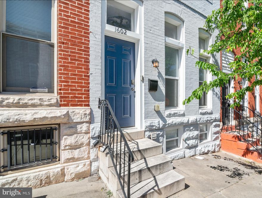 Welcome to 1602 E. Biddle Street — a beautifully renovated four-level Baltimore rowhome where thoughtful design meets modern city living. From the moment you step inside, the home unfolds with striking architectural details, soaring tray ceilings with ambient lighting, wide-plank flooring, and an open, airy layout designed for both everyday comfort and stylish entertaining.

The main level offers an inviting flow from the spacious living area with a sleek electric fireplace feature wall to the expansive dining space and fully renovated kitchen. Designed to impress, the kitchen showcases abundant shaker cabinetry, quartz countertops, stainless steel appliances, custom tile backsplash, and generous prep space rarely found in city homes.

Upstairs, the primary suite delivers a true retreat experience with elegant ceiling detail, a custom walk-in closet, and a spa-inspired ensuite bath featuring a luxurious soaking tub, oversized glass shower, dual vanity, and designer tile finishes. Additional bedrooms are spacious and versatile, complemented by beautifully updated bathrooms throughout the home.

The fully finished lower level adds even more flexibility with additional living space ideal for a media room, home office, gym, guest suite, or creative space, along with convenient laundry and storage areas.

Outside, enjoy a private fenced rear patio perfect for relaxing, entertaining, or summer grilling. Every level of this home has been carefully updated to blend timeless Baltimore charm with contemporary finishes and functionality.

Ideally positioned with convenient access to downtown Baltimore, Johns Hopkins, major commuter routes, local parks, dining, shopping, and city conveniences, this turnkey home offers refined urban living with exceptional space and style.