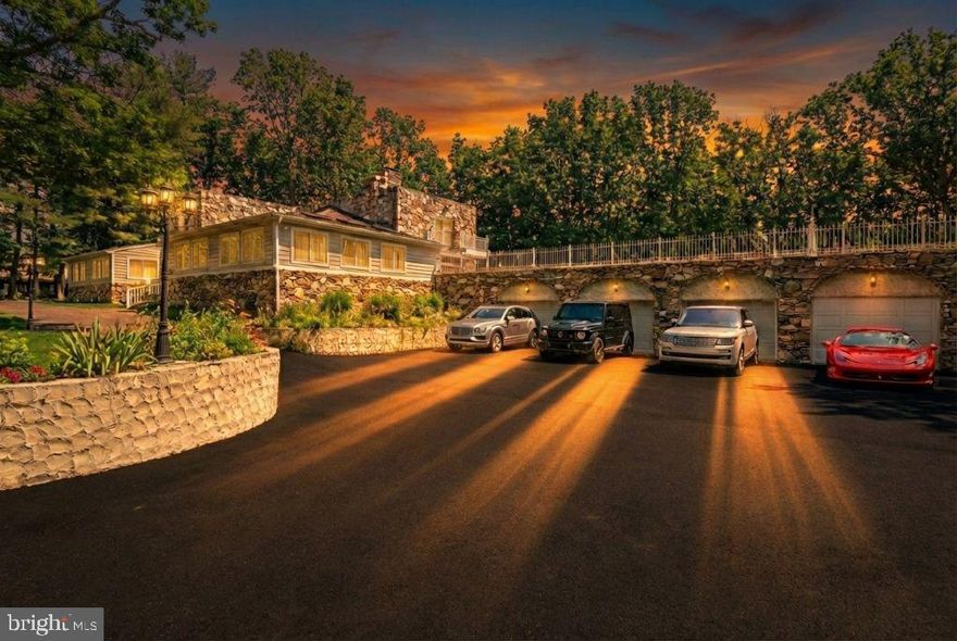 In a market largely defined by production-built homes, this exceptional custom residence stands apart—thoughtfully designed for those who seek originality, scale, and a truly bespoke living experience. A spectacular tailored home that was created for those who value architectural individuality, craftsmanship, and distinction.

***PROPERTY HIGHLIGHTS*** Elevator * Main-Floor Primary Suite * Second Floor Primary Suite * 4 Fireplaces *5-Ensuite Bedrooms *2 Bedroom + 1 Bathroom Basement Apartment *Outdoor Kitchen with Pool and Outdoor Shower * 3-Car Garage

Set on over two fully fenced acres at the end of a quiet cul-de-sac, 11701 Locust Grove Court offers a rare combination of privacy, scale, and lifestyle-driven amenities in Bowie. This thoughtfully designed residence delivers the space and flexibility today’s buyers seek—both indoors and out—while remaining conveniently close to commuter routes, shopping, and local conveniences.

Inside, expansive, light-filled living areas are designed for both everyday comfort and effortless entertaining. The home features well-proportioned rooms, a natural flow between living and dining spaces, and classic finishes that provide a timeless backdrop for personalization. The chef's kitchen anchors the main level, offering generous cabinetry, a waterfall island with a prep sink, an upscale range with a pot filler above, ample counter space, and a seamless connection to adjacent gathering areas, with a butler's pantry.

The private quarters include a spacious primary suite with an en-suite bath and substantial closet space, complemented by additional bedrooms suitable for guests, home offices, or multigenerational living. A flexible lower level offers additional rooms, including 2 bedrooms, a full bathroom, a kitchen, and a private entrance. A space fit for recreation, media, fitness, or extended living—tailored to suit your lifestyle needs.

Outdoors, the property truly distinguishes itself with a gated entrance. The fully fenced two-plus acres create a secure and serene setting ideal for entertaining, play, or relaxation. An elevated rooftop patio with an outdoor kitchen offers a striking space for al fresco dining, entertaining, and sunset views—an exceptional feature rarely found in the area. There is even a pool with an outdoor shower and a playground steps away.

Combining privacy, land, and distinctive outdoor amenities, 11701 Locust Grove Court presents a unique opportunity to enjoy refined suburban living with resort-style elements. Pre-approved buyers are welcome to tour.  To facilitate showings, a pre-approval letter or proof of funds for cash buyers is kindly requested.