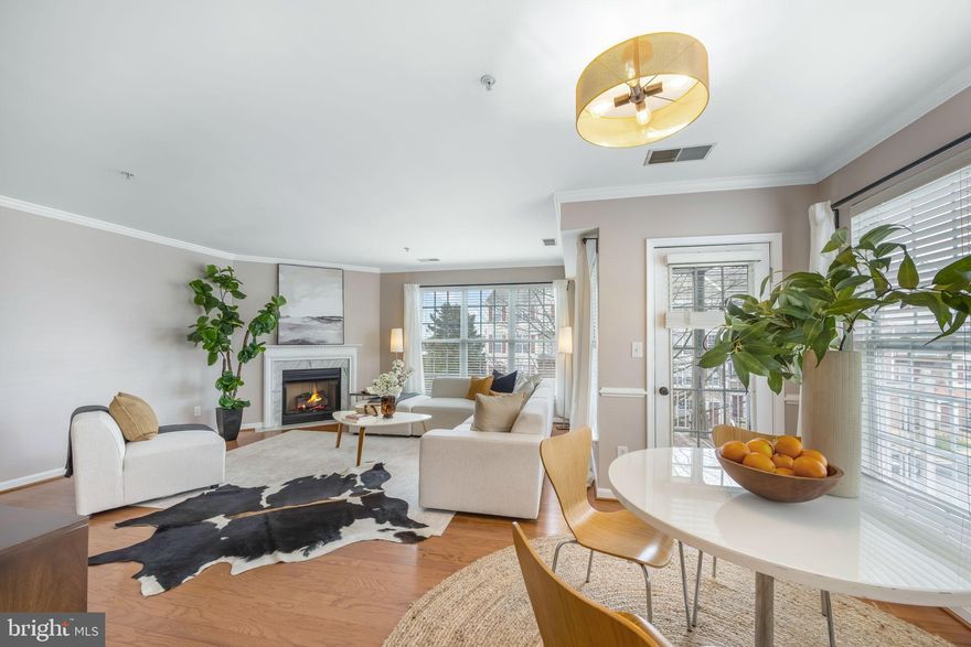 Beautifully maintained and move-in ready, this 2-bedroom, 2.5-bath corner unit features a rare two-level layout and over 1,200 finished square feet of bright, functional living space. With abundant natural light and extra windows, the home feels open and welcoming throughout.
The entry foyer offers a spacious coat closet and a large powder room before opening into the main living area. The main level includes a comfortable living room with a gas fireplace, a separate dining space with access to a private covered patio, and a well-appointed kitchen with white cabinetry, generous storage, stainless steel appliances, a gas stove, recessed lighting, and plenty of prep space for everyday living.
Upstairs, you’ll find two private bedroom suites with vaulted ceilings and well-appointed baths. The primary suite features an oversized walk-in closet and a spa-like bath with a dual vanity, soaking tub, and separate standing shower. A second suite offers comfortable space for guests or a home office, along with its own full bath and generous closet storage. A convenient upstairs laundry area adds everyday ease with extra storage space.
Bonus Features & Updates include fresh paint throughout (2024), new light fixtures, HVAC replacement (2022), a gas hot water heater (2021), and elegant crown and chair rail molding.
Enjoy life in sought-after McNair Farms with outstanding amenities including pools, tennis and basketball courts, playgrounds, walking trails, a clubhouse, and community center. Ideally located just minutes from the Silver Line Metro, Dulles Airport, the Toll Road, and major commuter routes, and only 0.2 miles from the Village Center at Dulles with shopping, restaurants, Starbucks, and CVS nearby.