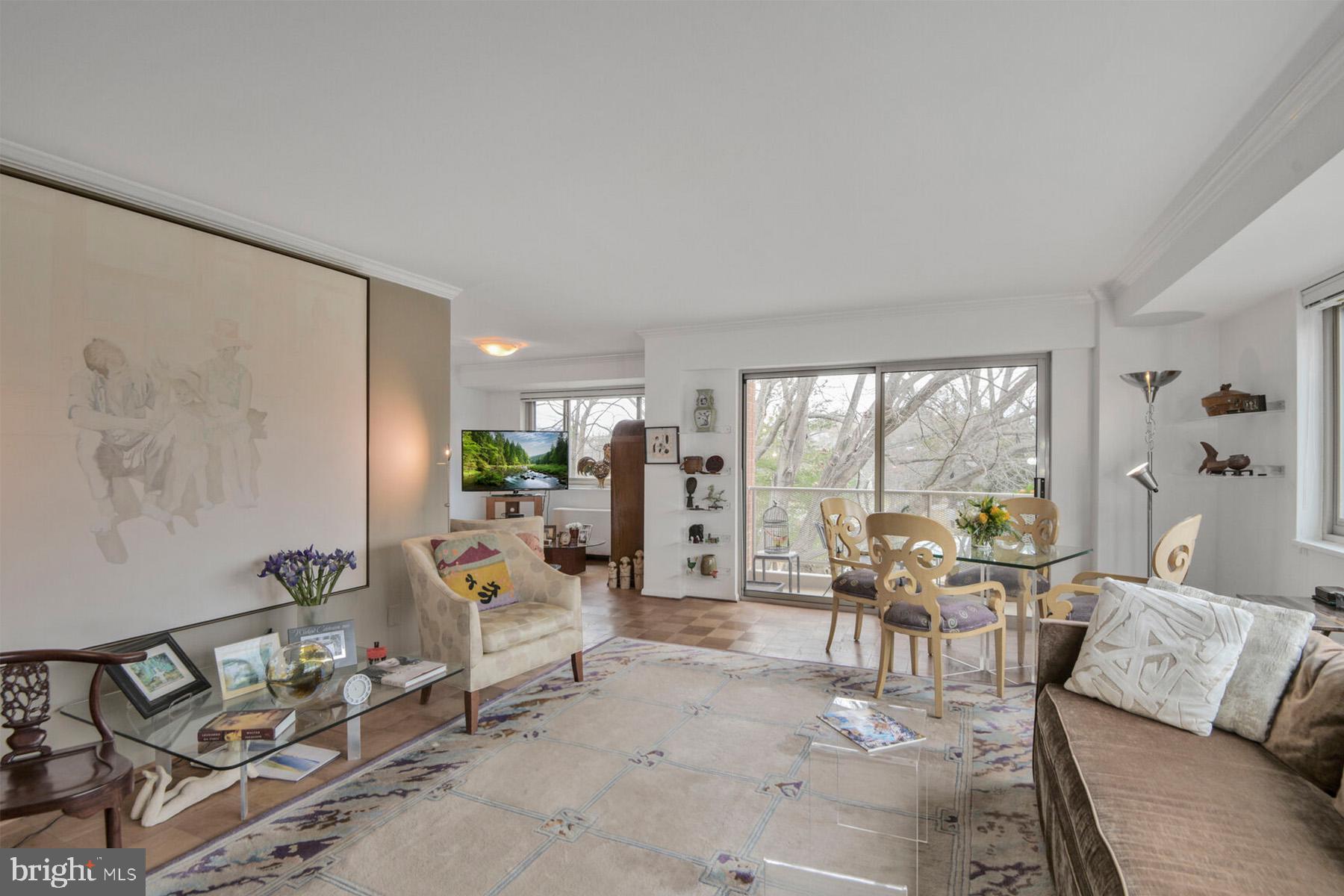 This rarely available spacious 3-bedroom, 2 full-bath, 1,500 sq ft, corner unit inspires many possibilities. A perfect combination of size and convenience. It's located near Friendship Heights and the Metro, in a quiet area off Little Falls Pkwy - away from the often heavy traffic on the major avenues. This large unit offers excellent natural light, a balcony overlooking treetops, and an assigned garage parking space. The monthly fee includes Property Taxes and most Utilities; the assigned garage parking space; a storage unit, on-site building manager, and more.... The renovated kitchen was installed several years ago, and the 2 full baths have been updated. The owner used two of the three bedrooms as a lovely formal dining room and a den/office with built-ins -- making the unit feel more like a home. But the rooms can be used as bedrooms, or however a buyer desires. As you enter the large, bright living room, you immediately see large windows and the inviting balcony with views of the Capital Crescent walking trail. This spacious floor plan also offers a den or dining area off the kitchen, a pantry closet, ample closet space, a large primary bedroom with ensuite bath, the 2 additional large bedrooms, and a 2nd full bath. The floor plan was partially re-designed by the owner to expand the foyer, creating a more welcoming entrance for guests. Kenwood House is located in the prestigious Chevy Chase neighborhood of Kenwood, known for its gorgeous cherry blossoms in the spring - and near Friendship Heights and Bethesda. The building provides guest parking, recently installed EV chargers, on-site building manager, and more. Enjoy this move-in ready, spacious 3-bedroom apartment. This sought-after neighborhood is close to shops, restaurants, Whole Foods and the Metro in Bethesda, Friendship Heights and Washington, D.C.