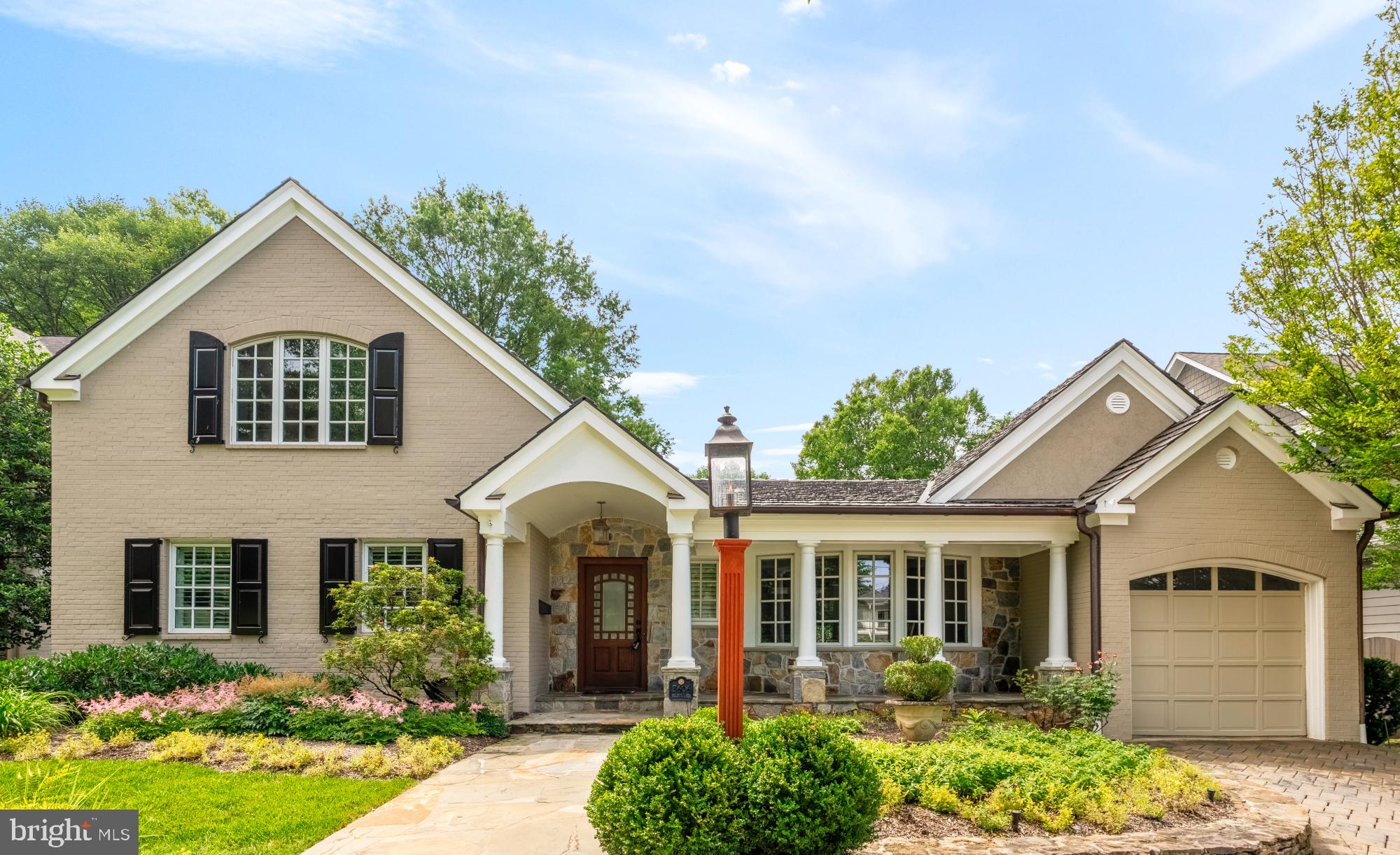 Classic charm meets contemporary living in this stunning Bethesda residence, perfectly situated in one of the area’s most coveted neighborhoods near the Metro and downtown. This four-bedroom, three-and-a-half-bath home offers a seamless blend of traditional architecture and modern luxury, designed for both everyday comfort and exceptional entertaining.
From the moment you arrive, you’re welcomed by a European-inspired exterior featuring stucco and stone finishes, a gas lantern, and a brand-new paver driveway leading to a garage and ample off-street parking. Inside, the warmth of a gas brick fireplace in the foyer and views of the resort-style backyard set an inviting tone. The main level includes a formal dining room, a sun-drenched chef’s kitchen with a granite island, Sub-Zero refrigerator, Viking gas range, and a breakfast nook overlooking the lush front yard. Anchoring the home is a vaulted‑ceiling family room with a stone wood‑burning fireplace, custom built-ins, and a concealed Sonance sound system paired with Sonos controls—perfect for cozy nights or movie marathons.
The main floor also hosts three spacious bedrooms, a stylish powder room and full bath, a home office with serene pool views, and a dedicated laundry room with an additional fridge. Downstairs, the finished lower level provides flexible space for a second living area, gym, or guest suite, complete with a custom bar and full bath. Upstairs, the private primary suite feels like a luxury retreat, featuring soaring ceilings, a seating area, extensive closet storage, and a spa‑inspired bath with a jetted tub, oversized walk‑in shower, and dual vanities.
Step outside to your own private oasis—an entertainer’s dream with a heated pool, integrated hot tub, cascading waterfall, and multiple lounging areas. Mature landscaping, including crepe myrtles and Norwegian evergreens wrapped in twinkling lights, frames the space, while a pergola draped in wisteria adds a touch of magic. An outdoor fireplace and Sonos‑controlled sound system complete the scene, making this backyard as ideal for peaceful evenings as it is for lively gatherings.
Just steps from Downtown Bethesda’s vibrant core, this home offers effortless access to an array of shops, restaurants, cafes, and entertainment along Bethesda Row. Nearby grocery choices include Harris Teeter, Trader Joe’s, and Whole Foods Market—bringing everyday convenience right to your doorstep . This exceptional home offers a rare opportunity to enjoy timeless style, modern convenience, and unparalleled outdoor living—all in the heart of Bethesda. Co-Listed by Tiffany Cloud @ Meredith Fine Properties.