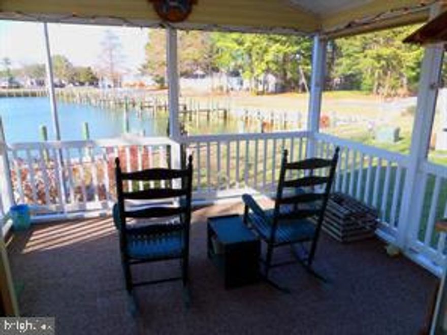 This exceptional waterfront property is a haven for boating enthusiasts, boasting a dock capable of accommodating a 30-foot boat. Imagine embarking on a relaxing cruise across the bay, returning with a fresh catch to savor. The property's bulk-headed dock also invites crabbing and fishing excursions. Inside, the residence showcases a beautifully appointed kitchen with solid surface countertops and an island, complemented by four generous bedrooms and three bathrooms. The location is nothing short of ideal, offering a stunning water view and proximity to Paradise Grill and The Clubhouse at Baywood. Perfect for entertaining, the home features a spacious family room, two screened porches, and a rear deck with a patio overlooking the water. Ample storage is available for boating and fishing gear, as well as garden tools. Situated in Pot Nets Seaside, this property provides seamless access to the Indian River and Rehoboth Bays, complete with fuel docks and a bait and tackle store. Lot lease is $1656.  Low taxes. $428 yearly 

Contingent on park approval PotNets Seaside