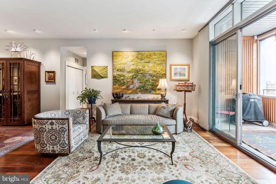 Welcome to 1101 Locust Street unit 8F in the Western Union Building.  This large South West corner home offers one of the most desirable floorplans and layouts in the building.  With over 2,200+ square feet of well appointed and beautifully designed living space featuring 3 Bedrooms, 3 Full Bathrooms, plus Den, 2 Garage Spaces, 2 incredible Balconies and an amazing 9x12 ft Storage Room, located just a few steps from the unit, you won't find anything better for easy city living.  Enjoy 24 hour doorperson/concierge service, on-site private fitness center all in a centrally located Washington Square West location.  Natural light and spectacular sunset views abound with an incredible glass to square foot ratio with southern and western exposures throughout.   Enter the home into the foyer with large coat closet situated next to the convenient open Den that offers great flexible space for a study, office or flex space.  Just beyond is the open floor plan Kitchen, Dining and Living room spaces showcasing gorgeous hardwood floors, high ceilings, designer lighting package and recessed lights.  Chefs kitchen offers stone counter tops, top end appliances, plenty of cabinet and prep space with an island for casual dining and a walk-in pantry that houses everything you need for day to day cooking or large party entertaining.  The Dining room area can easily seat 8+ for dinner and the enormous living room allows access to the west facing balcony with floor to ceiling glass doors and a front row seat to amazing sunset views.  This well designed split floorplan has the large primary suite privately placed to one side and the other 2 bedrooms and bathrooms on the other side of the unit, bookending the main living spaces.  Primary BR has a dual sink ensuite bathroom w/ beautiful stone tile work and shower, deep walk-in custom closet and an  Italian custom designed wall length closet system, as well as, the 2nd west facing balcony.  The south side of the condo offers the 2nd bedroom w/southern views and large closet.  There is a Laundry Center and large hall storage closet as well as full bathroom situated between the 2nd and 3rd BR's.  The third BR is very generous in size and offers unobstructed southwest corner views and an ensuite marble bathroom with radiant heated flooring.   All closets feature custom built-ins by Closet by Design making storage even easier and more organized.  The owners have made extensive upgrades and improvements throughout and a list along with a detailed floor plan is available upon request.  With a walk score of 100 this location enjoys convenient and easy access to the city's best restaurants, shopping and park spaces.  For additional information or to schedule a private tour please reach out today.