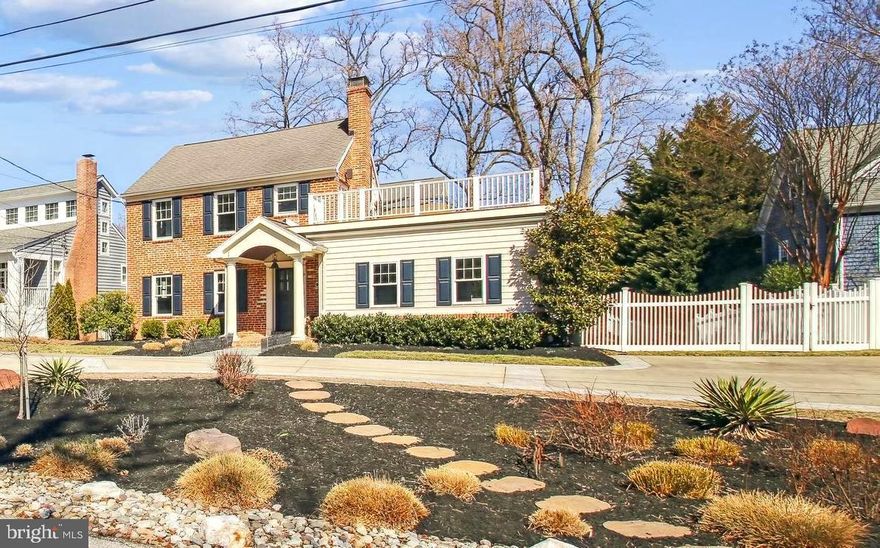 Refined Coastal-Classic Waterview Bay Ridge Home nestled just two houses from the private Bay Ridge beaches and bay-front community pool.  Living in the sought-after Bay Ridge neighborhood is an experience like no other with amazing community events such as the annual Beach Party, 4th of July Parade and celebration, and End of Summer Jamboree, just to name a few.  Across the street you’ll also find the Big Woods Conservation Area with scenic hiking and mountain biking trails leading to Blackwalnut Cove.  This vibrant neighborhood also offers a protected marina with clubhouse on Lake Ogleton, which is just minutes by boat to City Dock and the mouth of the Bay; also hosting a new playground, basketball and pickle ball courts, kayak racks, and sports fields. Whether you’re a boater, paddle-boarder, runner, hiker, swimmer, fisher, or dog walker, this community has something for everyone. 
Located  on a generous 0.34-acre flat lot, this light-filled retreat has been freshly refined enhancing its already impressive appeal. Enjoy breathtaking water views from multiple vantage points, including the sprawling upper deck with a Jacuzzi hot tub overlooking the Chesapeake Bay. The thoughtfully designed interior features rich walnut hardwood floors, a spacious great room, with a coffered ceiling engineered to support the hot tub above, complete with wood burning fireplace centered in artisan crafted mantel and built in cabinetry.  The gourmet eat-in kitchen is equipped with updated appliances and a coveted Wolf gas cooktop built into the custom granite island perfect for entertaining and casual dining as a centerpiece of the home.  The butler's pantry with wine rack and bar sink ties the dining room, with its exquisite crystal chandelier, to the kitchen.  With five bedrooms plus a newly redesigned loft/studio, this home provides flexible space for work, relaxation, and hosting. 
The primary suite offers spectacular water views, a loft area, bonus closet, and a spa-like ensuite bathroom complete with heated white marble floors, designer Duravit vanity with countertop washbasins,  double shower, and medicine cabinet with touch lighting.  The custom California Closet has ample room for all of your clothing and footwear needs. The second-level shared bath is stylishly designed with frosted glass privacy doors and custom cabinetry with  a white granite top.  The finished lower level with full bathroom could be anything from a recreational space, den, or a gym to an in-law suite.   Step outside to enjoy multiple decks piped for gas grilling and fire pits- perfect for entertaining or unwinding. Wash off in the enclosed cedar outdoor shower after a day at the beach.  Enjoy the rain garden in the front yard and other conservation landscape features including native flowering plants throughout and rain barrels.  Don’t miss this rare opportunity to own a beautifully refreshed home in one of Maryland’s most treasured historic waterfront communities!