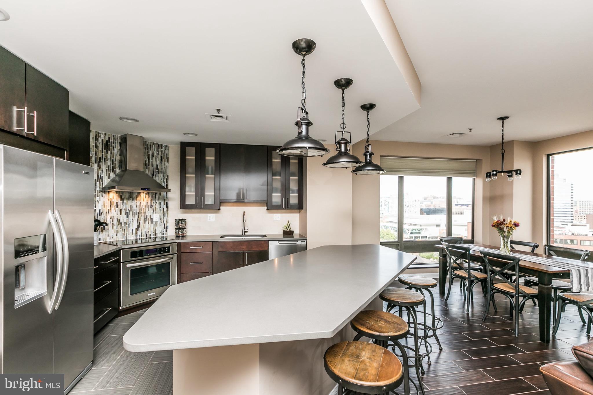 Truly exceptional and beautifully remodeled 2BR/2BA condo in Harborview’s coveted North
Tower—with spectacular views from all rooms, including magnificent Inner Harbor sunrises and Camden Yards sunsets.
This immaculate, move-in-ready unit features a gourmet open kitchen with an expansive
breakfast bar, gorgeous floors throughout, a spacious primary suite with an updated en suite bath and walk-in closet, plus a deeded garage parking ensuring the utmost convenience, and private storage.
Enjoy rare privacy and serenity in this well-run and beautifully maintained building with only 3 double-door units per floor, no shared walls, and no sound from neighbors above or below. Luxury amenities include a 24/7 doorman, concierge, and porters, secure package/mail service, and direct indoor access to The Royal Sonesta Harbor Court Hotel. An optional membership offers access to the pool, fitness center, racquetball and tennis courts, as well as their restaurants and lounge. Residents can enjoy complimentary wine and food events, including a stunning and festive holiday party.
Just steps to the Inner Harbor Promenade, dining and nightlife options, the stadiums, and a new waterfront park (opening in 2026). Quick access to the MARC train with services to DC, and Interstate 83 and 95.
