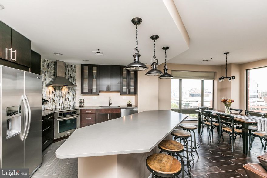 Exceptional Harbor Court condominium with Panoramic Harbor & City Views.  This fully remodeled, immaculate 1,541 square foot residence is one of Harbor Court's most beautifully updated 2 bedroom, 2 bathroom condos, offering magnificent Inner Harbor sunrises and stunning Camden Yards sunsets.
The open concept living and dining area flows seamlessly to the modern chef's kitchen with quartz countertops, premium appliances, custom cabinetry and an expansive island. The spacious primary suite features a spa-style bath and walk-in closet, while the second bedroom and full bath are perfect for guests or a home office. Every detail has been thoughtfully upgraded from flooring to lighting and hardware.  The unit also has a Resideo water leak detection system which protects the unit with an automatic water turn off in the event of a leak, and also notifies the front desk. Building amenities include 24-hr front desk concierge, a deeded garage parking space, private storage, doorman services, porters secure indoor access to the Royal Sonesta Hotel's pool, fitness center available through an optional membership. Step outside to enjoy the Inner Harbor promenade, Otterbein, Federal Hill, the stadiums, restaurants, shops and easy commuter routes. Don't wait  to schedule your private tour!
.